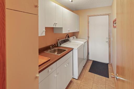 Main floor laundry room also leads to the attached double garage