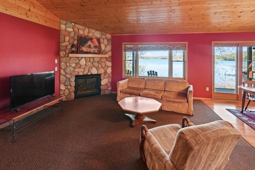 Beautiful stone gas burning corner fireplace.