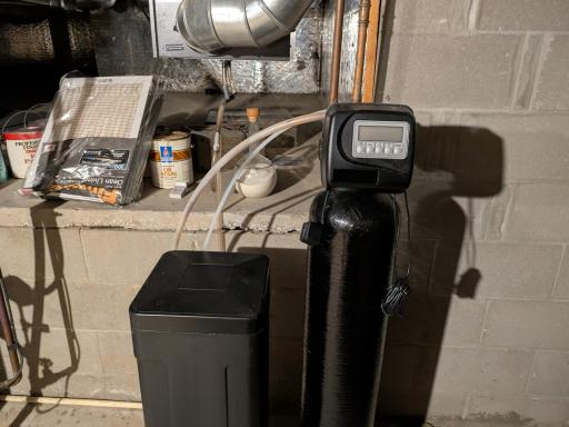 Water softener and air exchanger above
