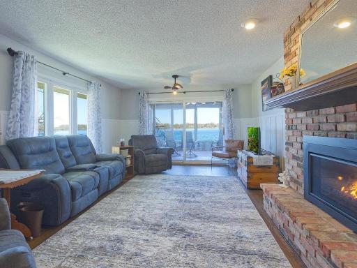 Living room w/sliding glass door to 3 season porch