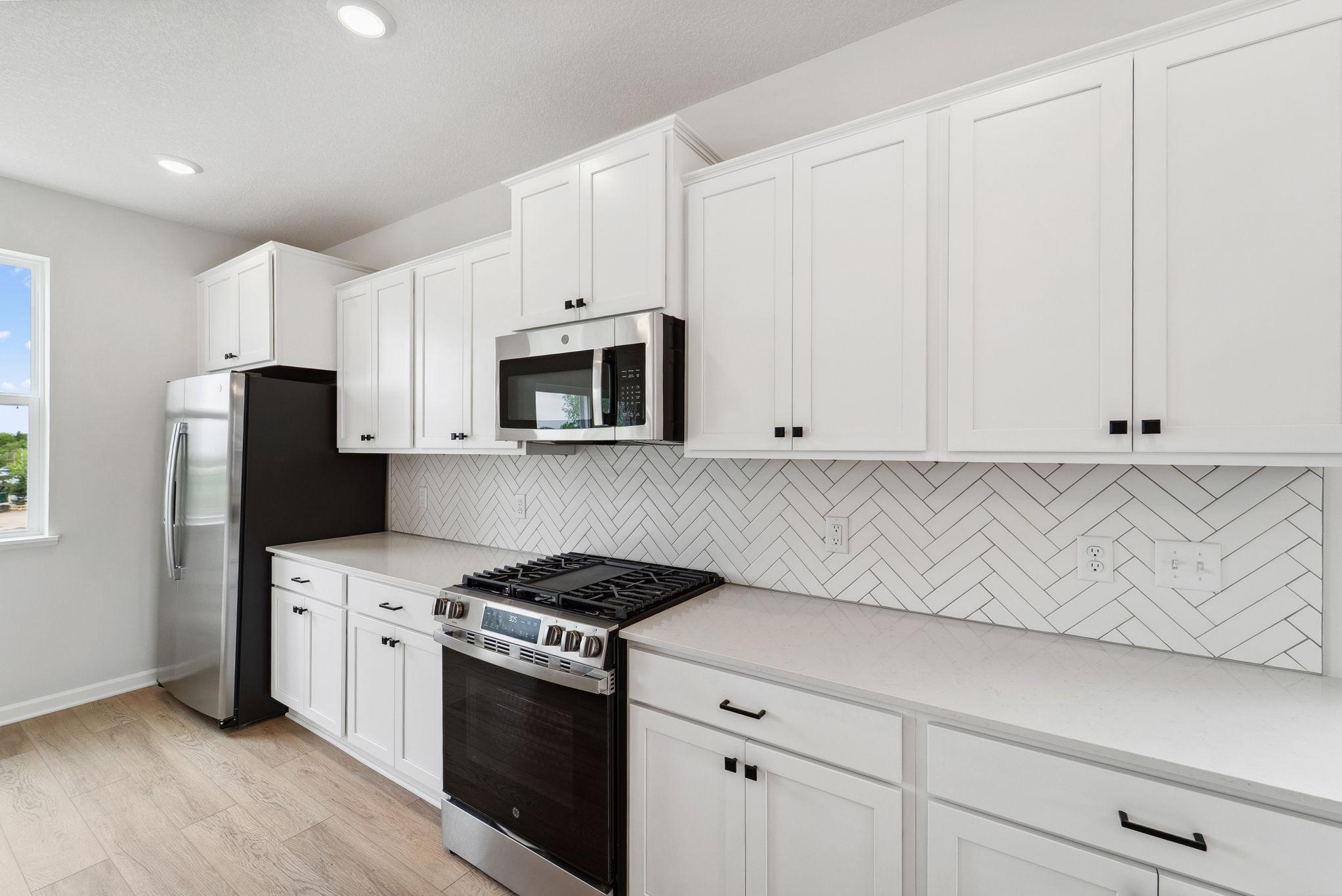 Designer touch with this backsplash putting a face to the kitchen with a touch of class.