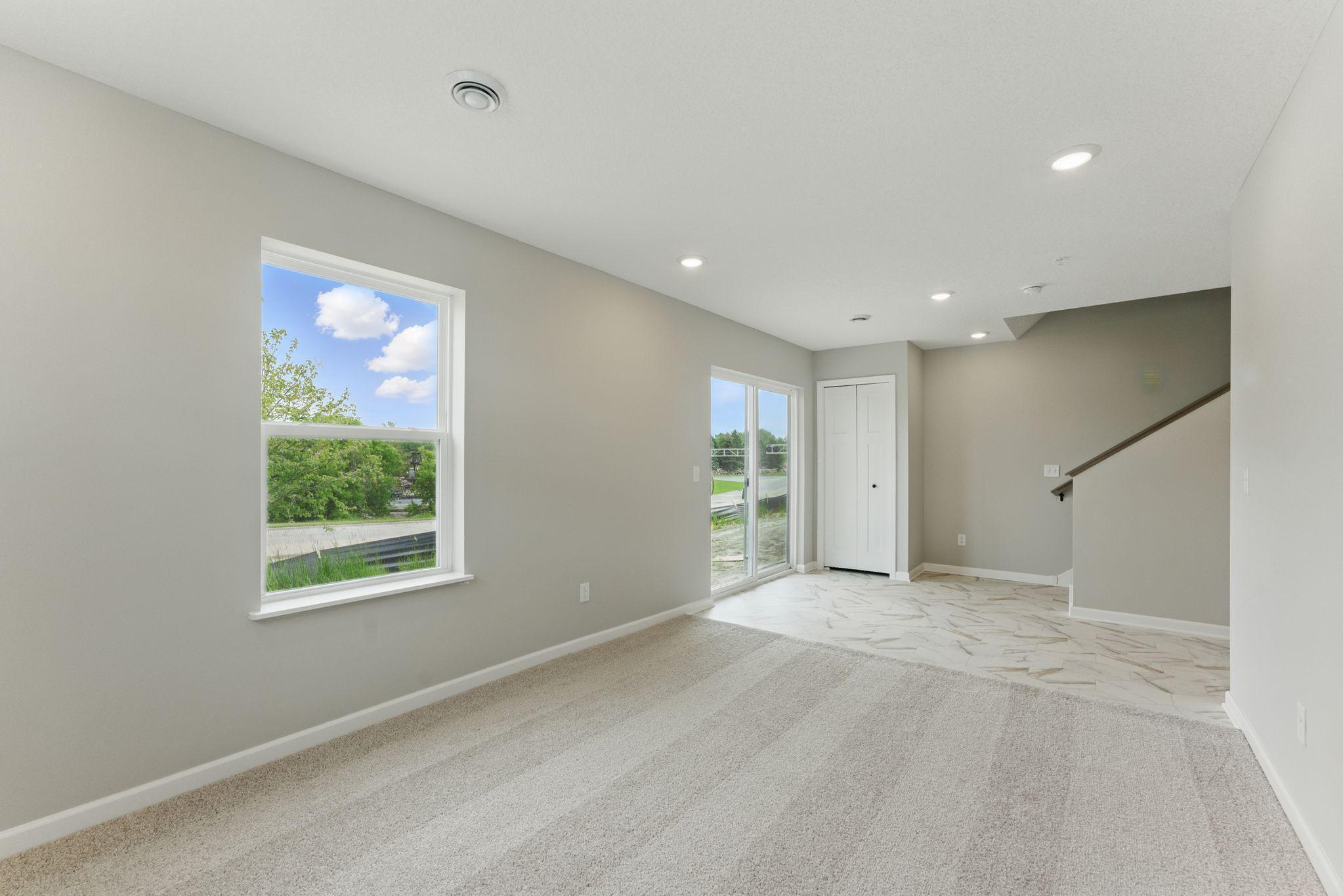 LL Rec Room has tons of natural light and access to the rear yard space