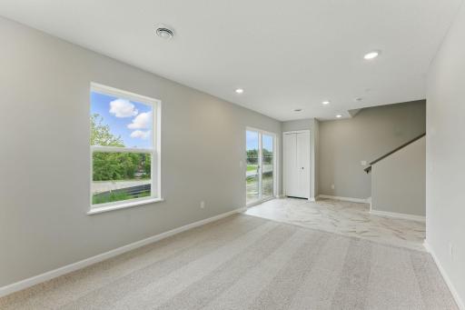 LL Rec Room has tons of natural light and access to the rear yard space