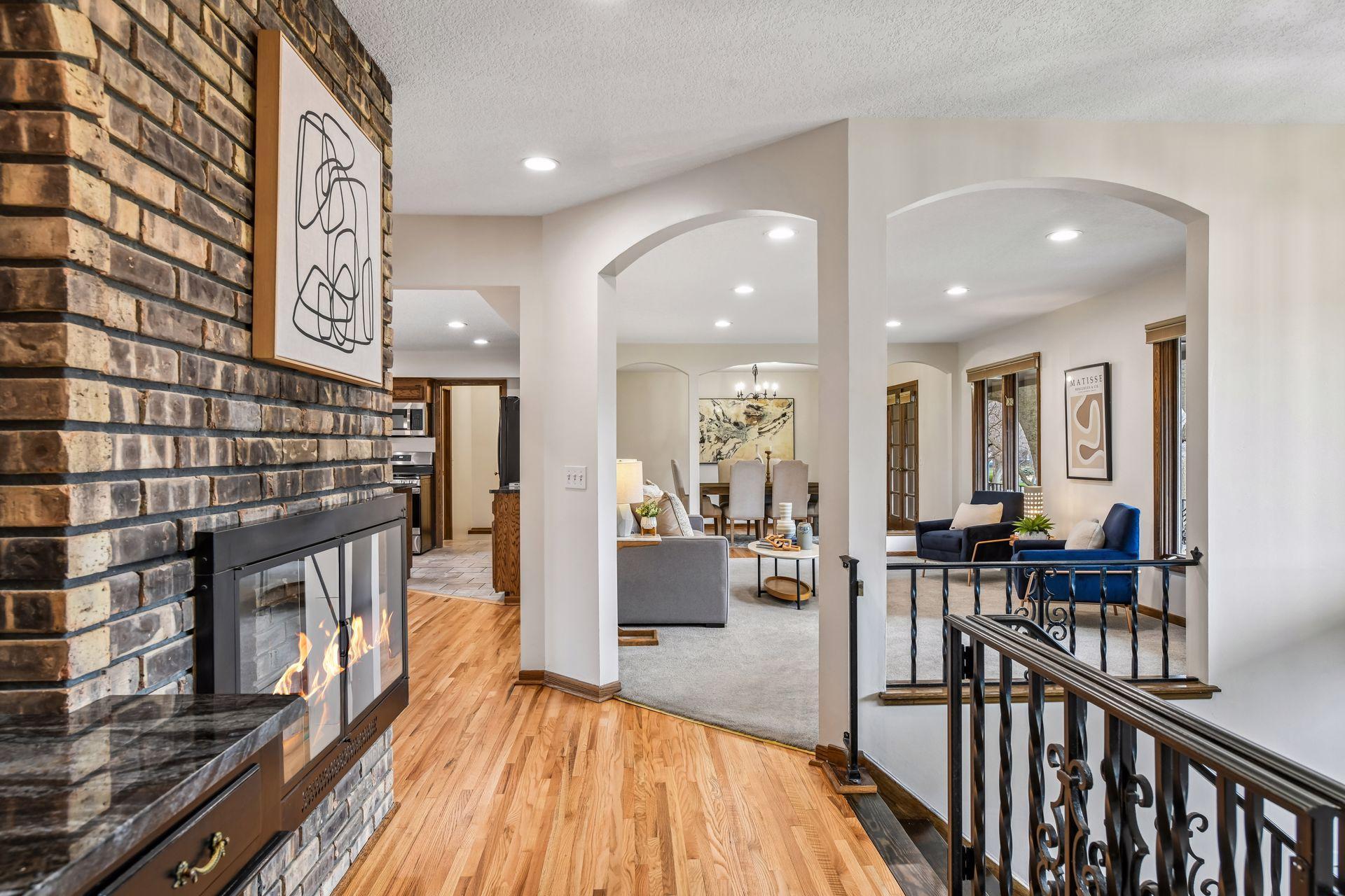 Upper-level Foyer with 3-sided Fireplace.