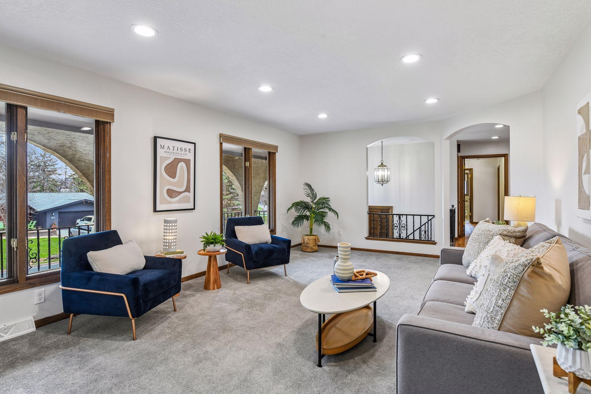 19x13 Upper-level living room with Fresh paint and east-facing windows.