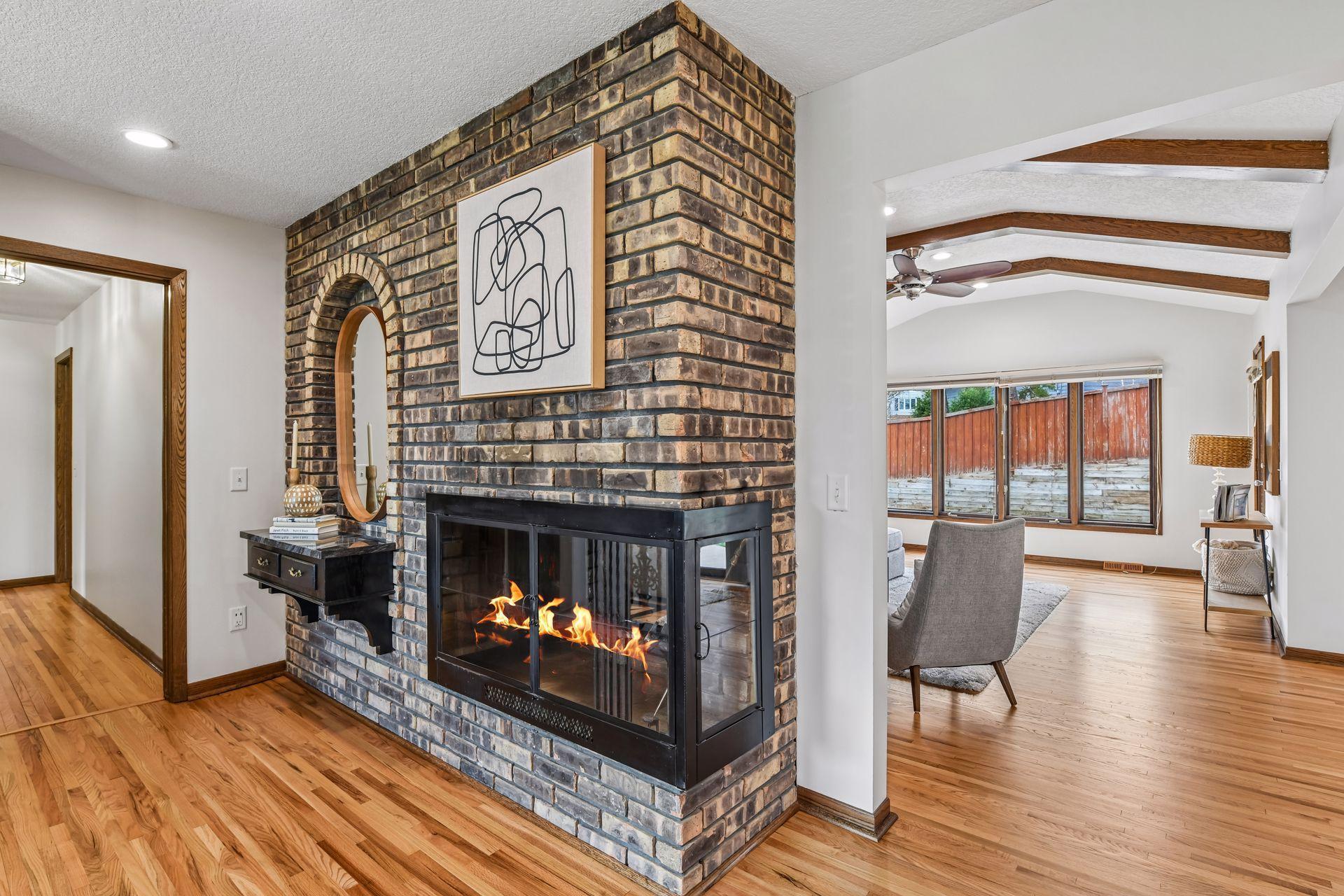 Upper-level Foyer with 3-sided Fireplace.