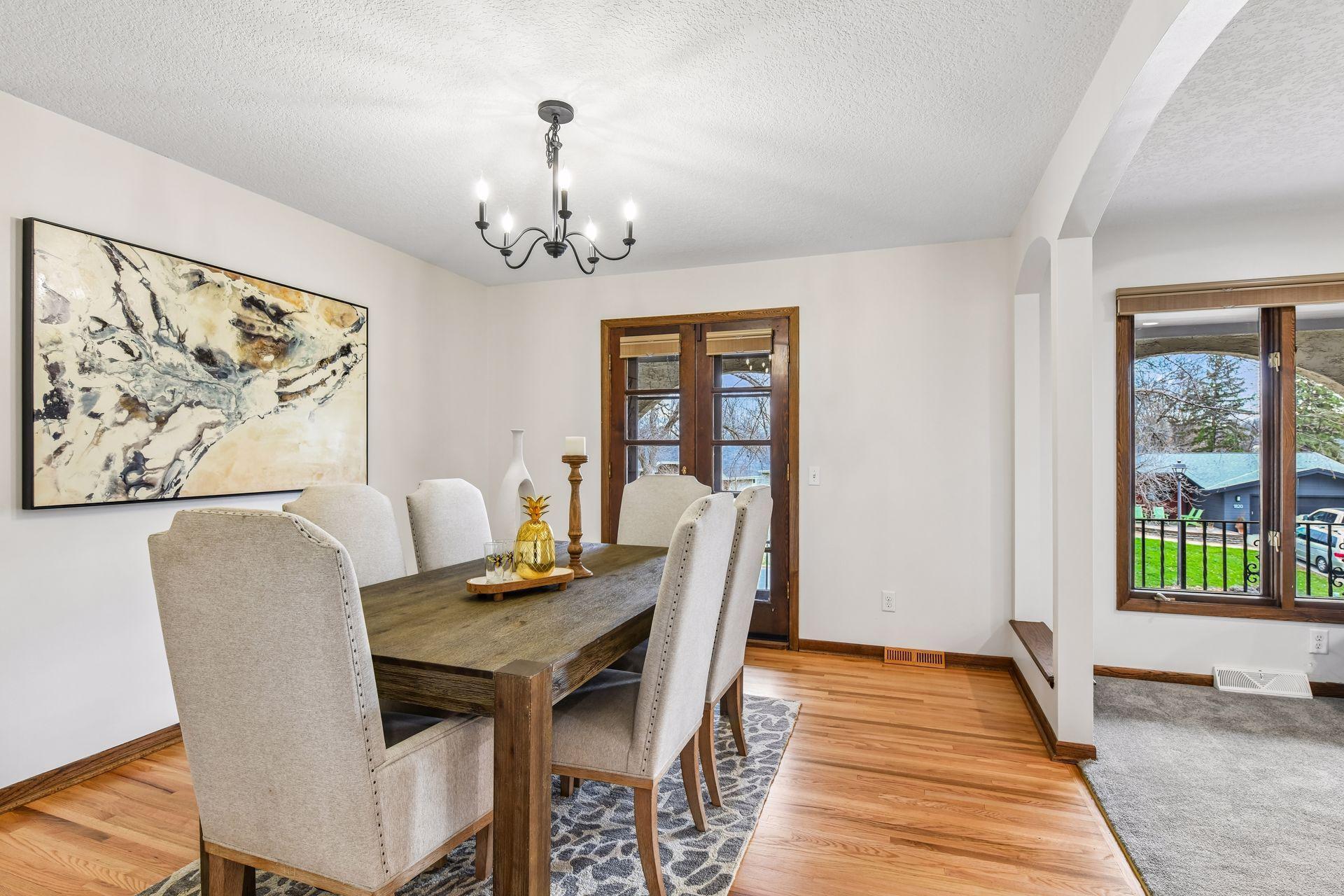 13x12 Upper-level Dining Room with newly refinished oak hardwood floors and Fresh paint. East-facing windows.