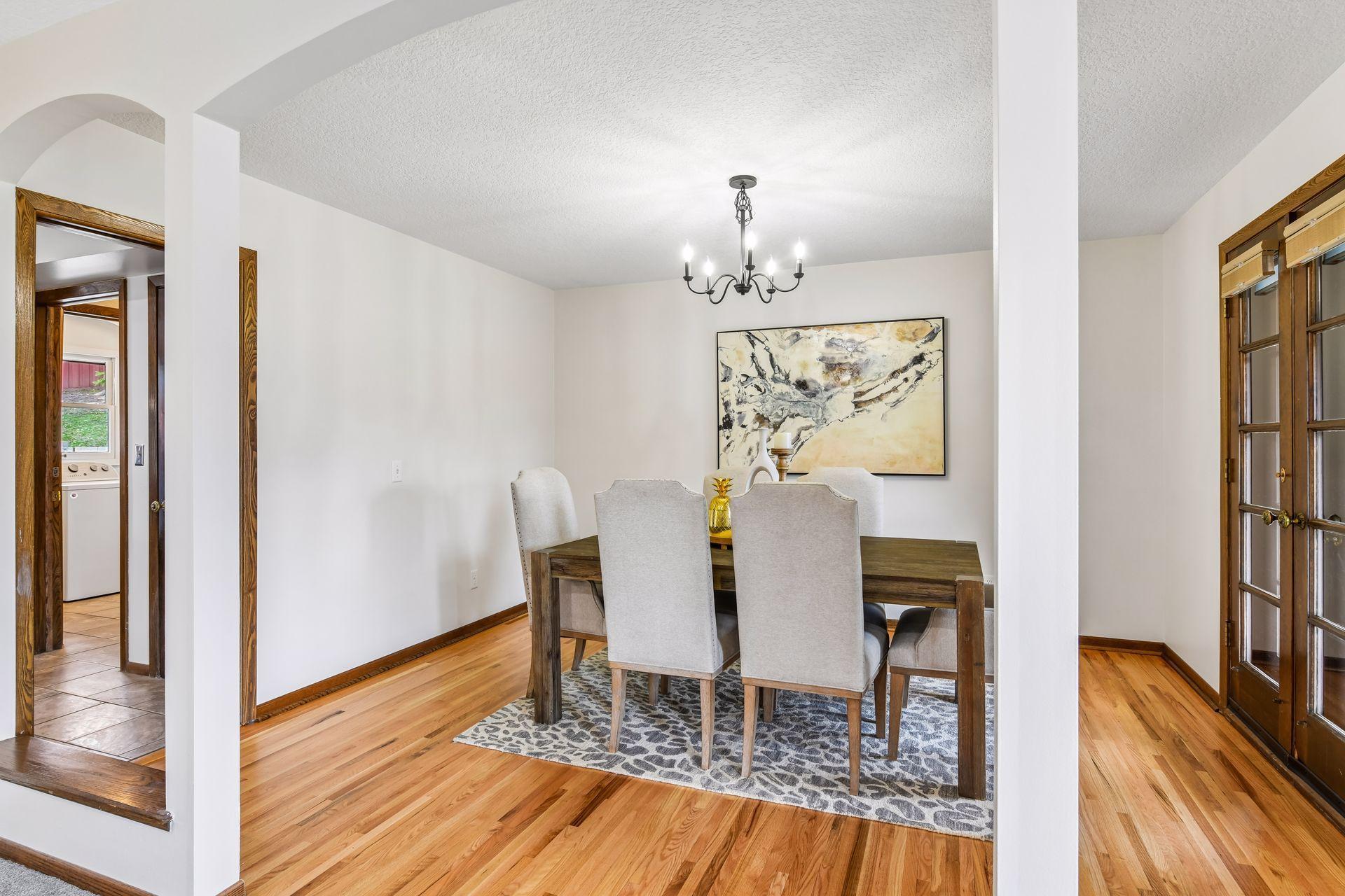 13x12 Upper-level Dining Room with newly refinished oak hardwood floors and Fresh paint. East-facing windows.