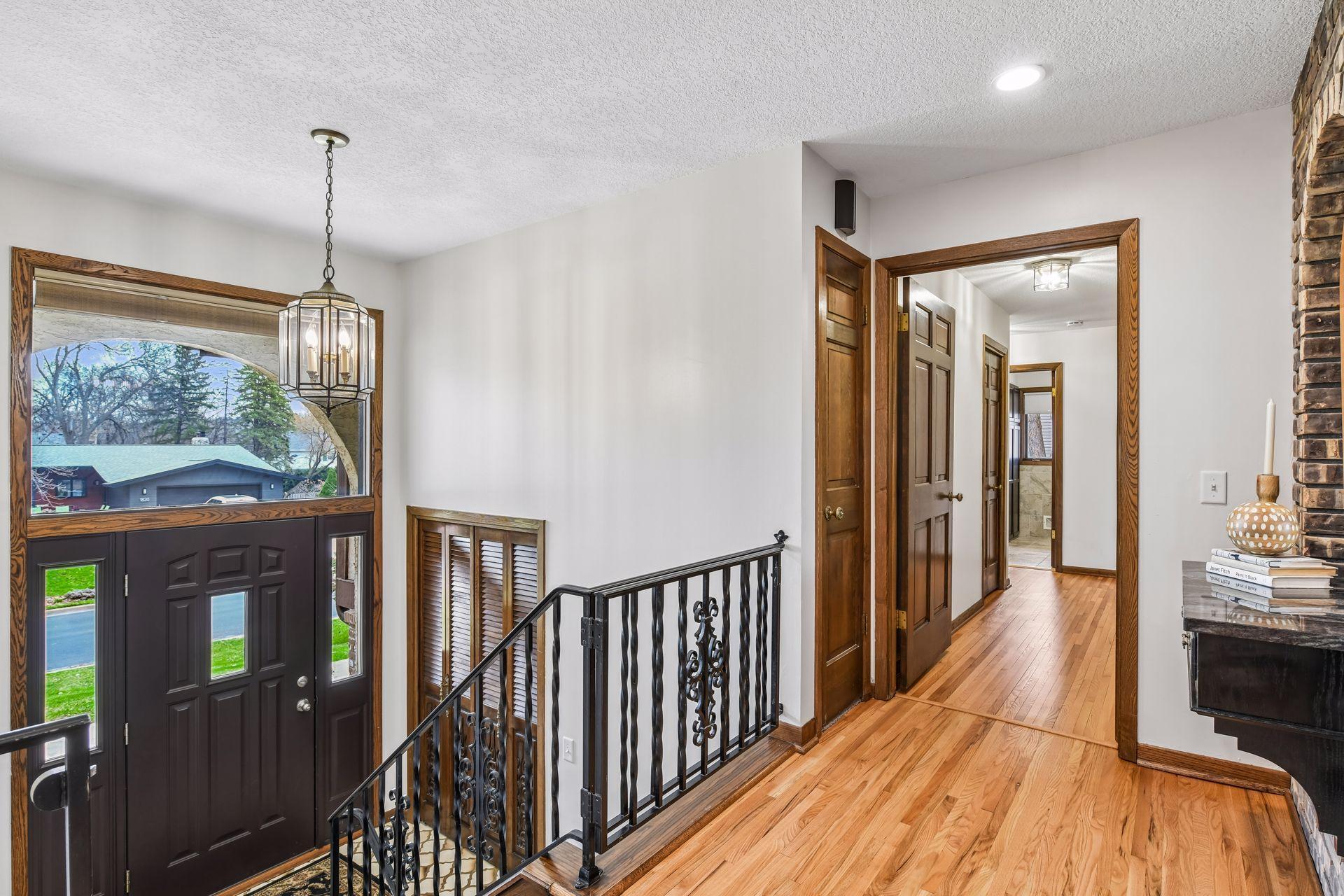 Upper-level Foyer with 3-sided Fireplace.