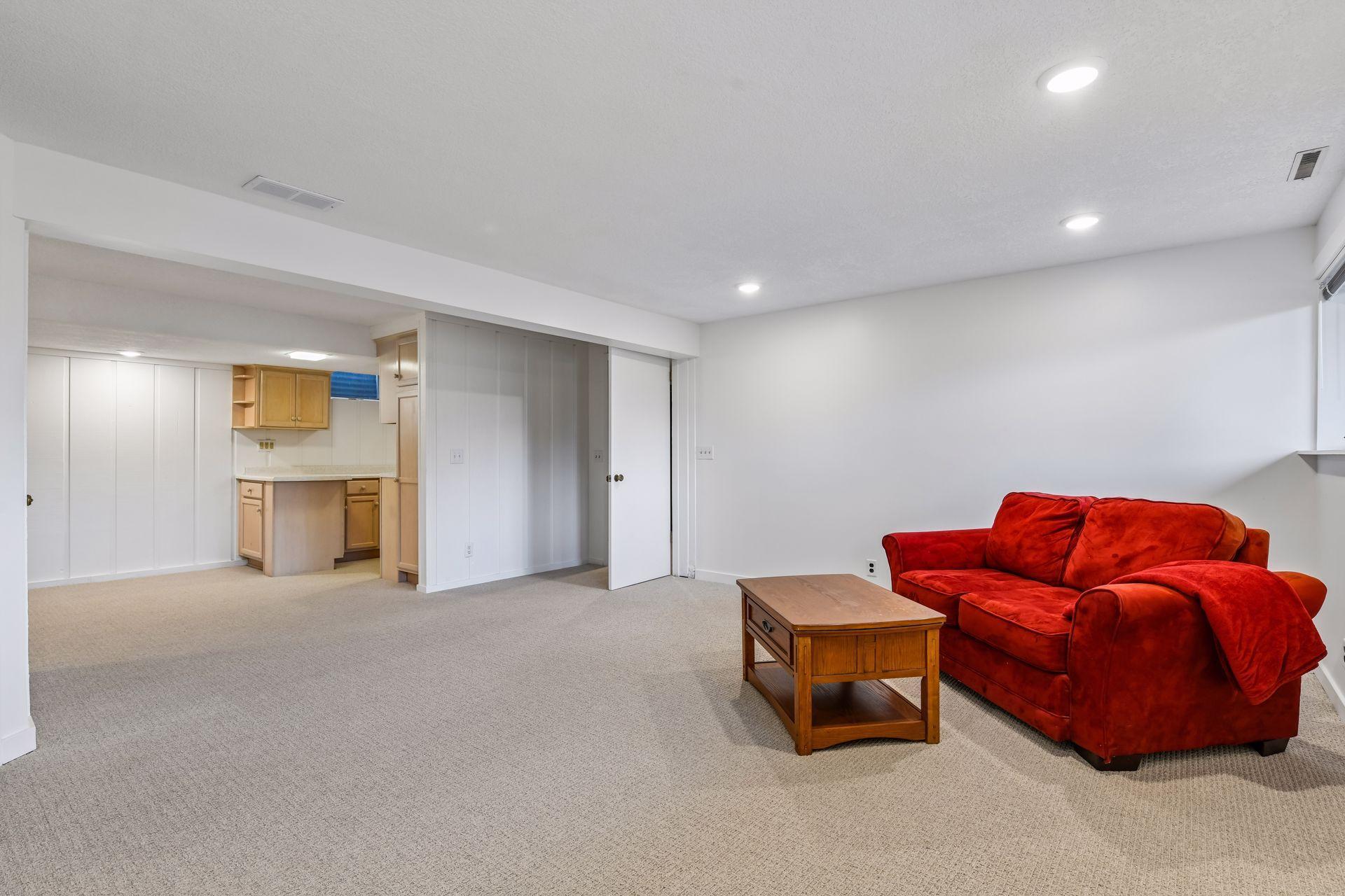 18x17 Lower Level Family room with new carpeting and fresh paint. East-facing windows
