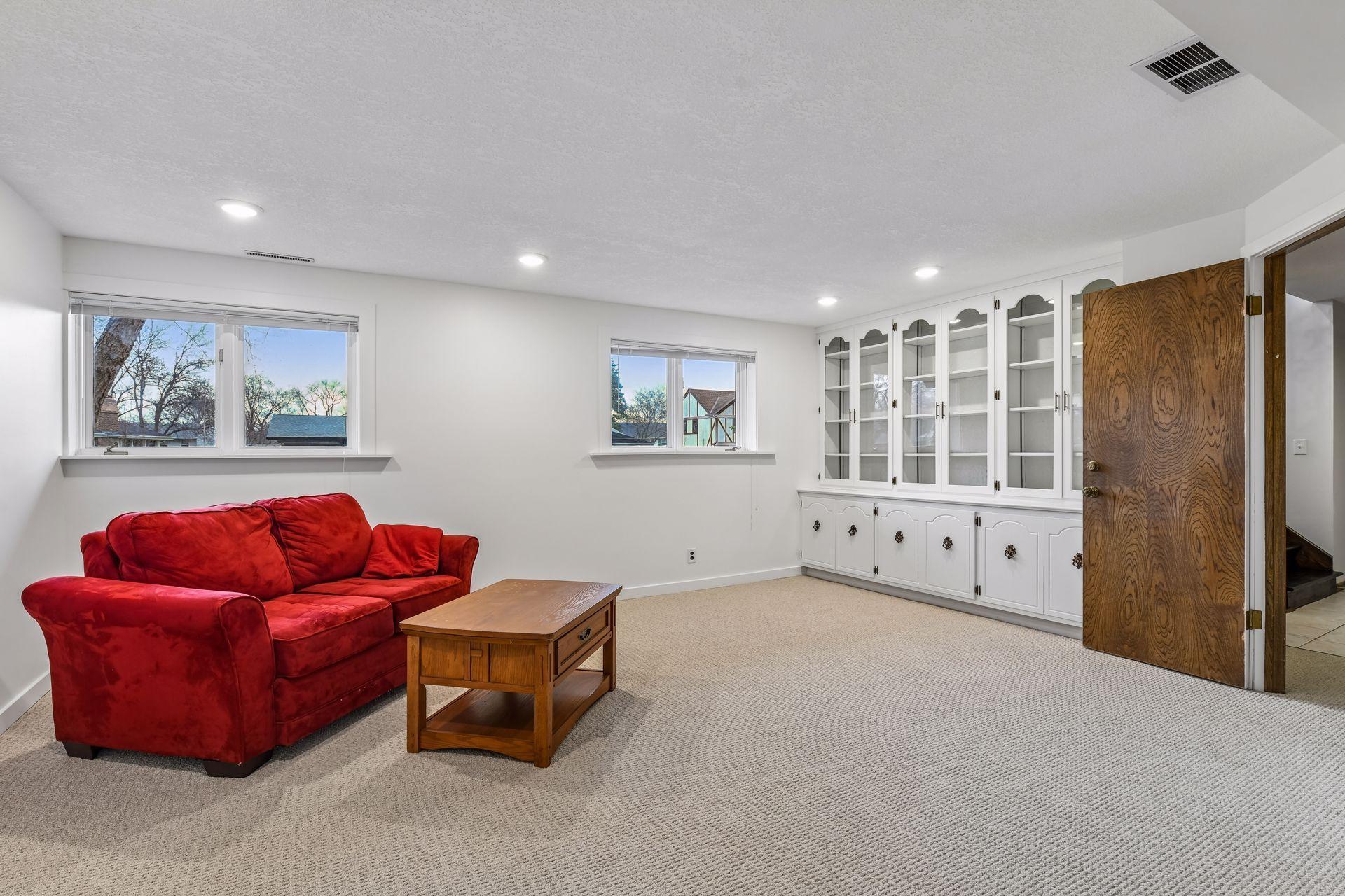 18x17 Lower Level Family room with new carpeting and fresh paint. East-facing windows