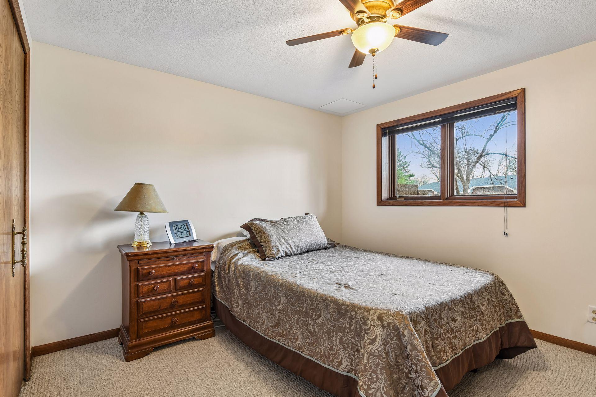 13x12 Lower Level Bedroom #4 with new carpeting, fresh paint, and east-facing windows.