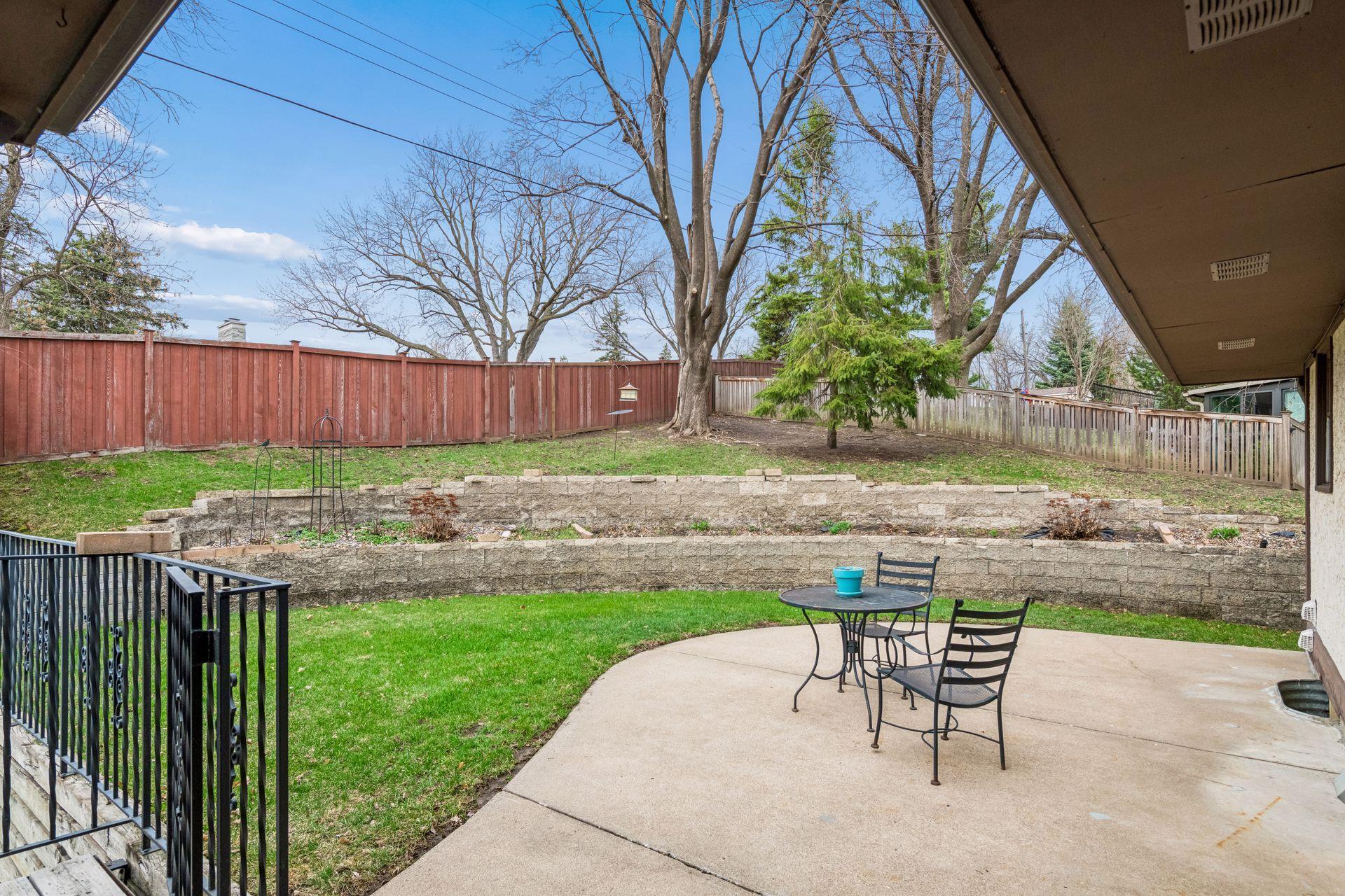 Backyard with a concrete patio.