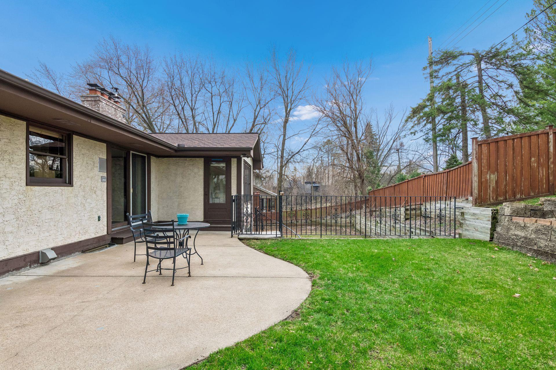 Backyard with a concrete patio.