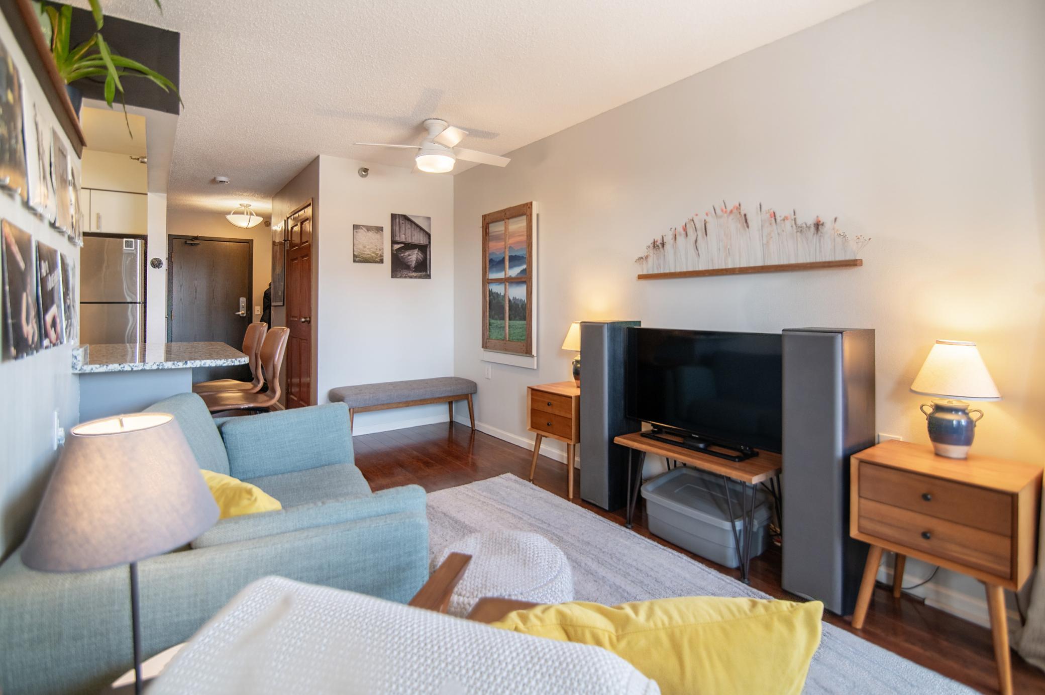 This space is thoughtfully finished with a fold-down table for eating and entertaining as well as space to kick back and relax.