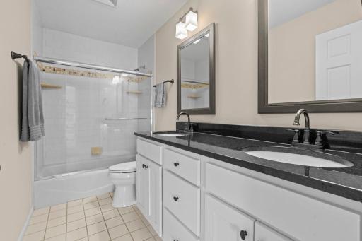Upper level hallway bathroom with double vanity
