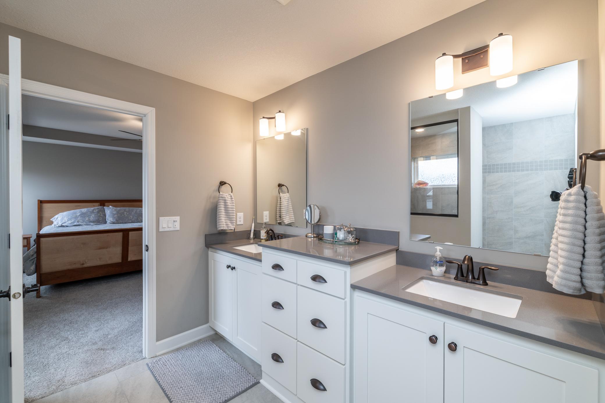 Luxurious primary bath with dual vanities and ample counter space