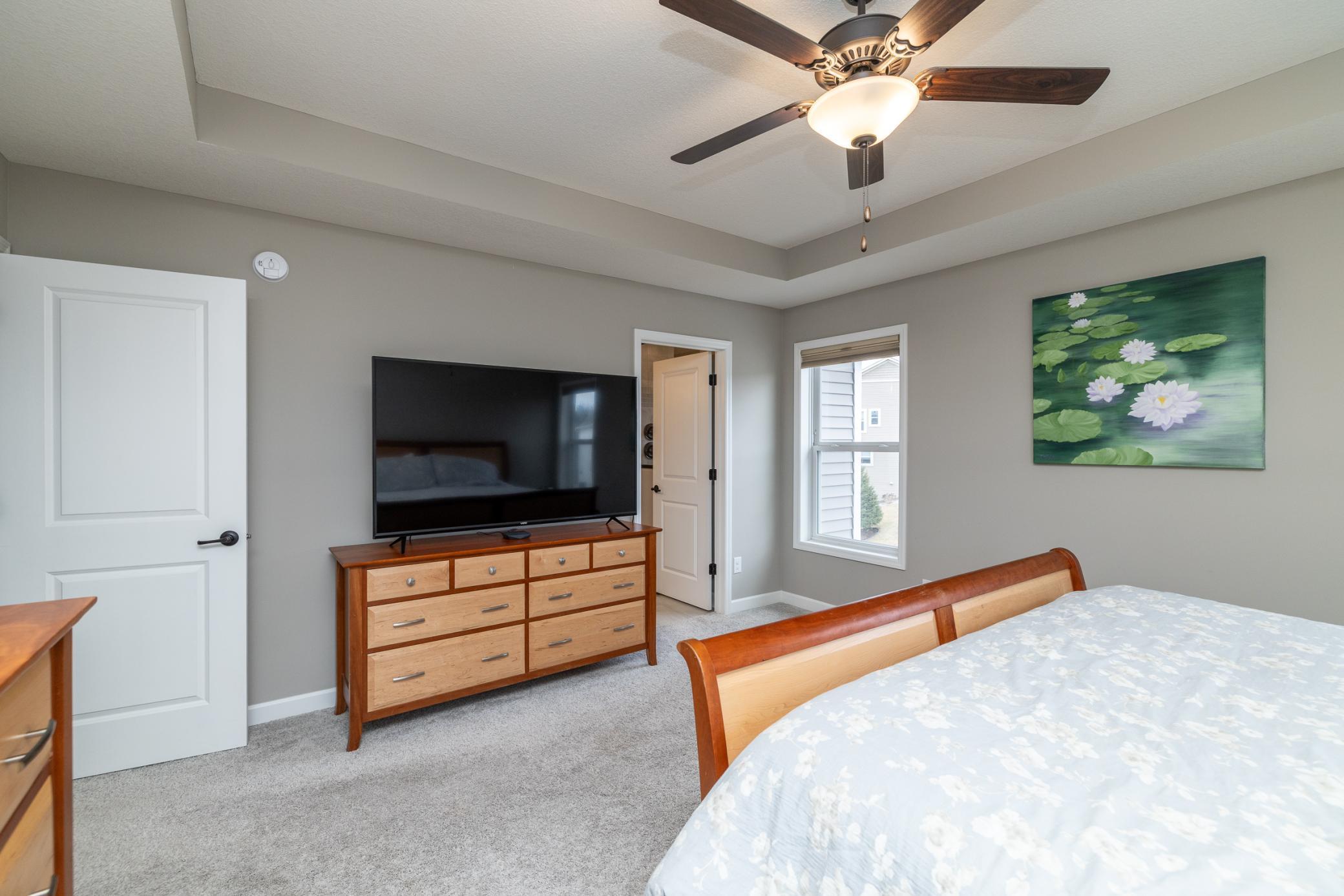 Primary suite with generous layout and private ensuite access