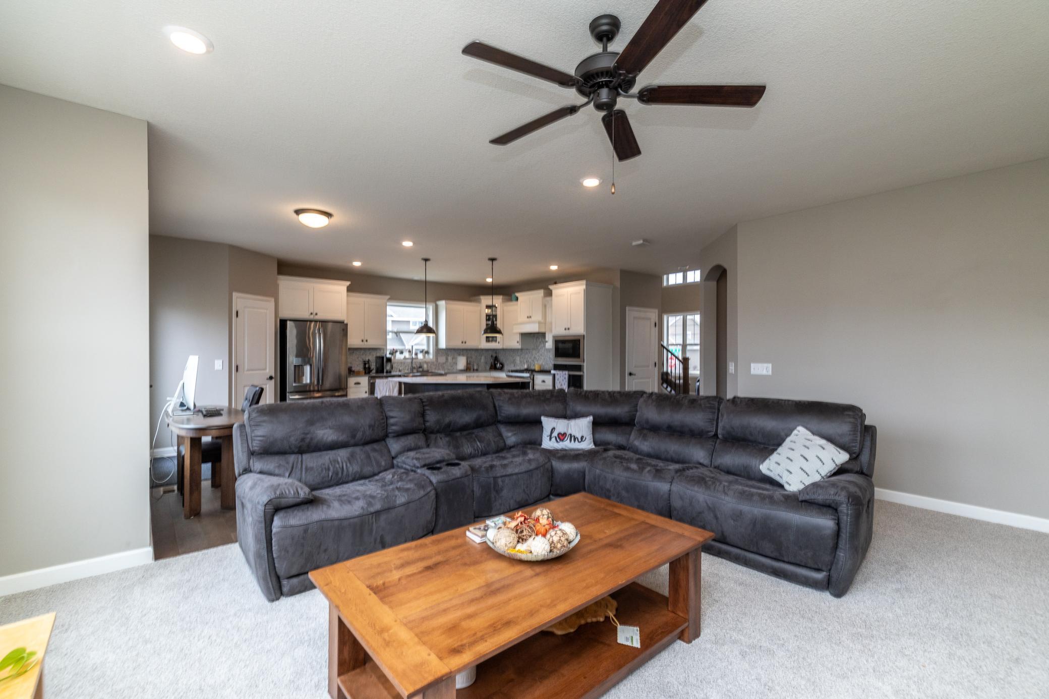 Open main level with seamless flow between family room and kitchen