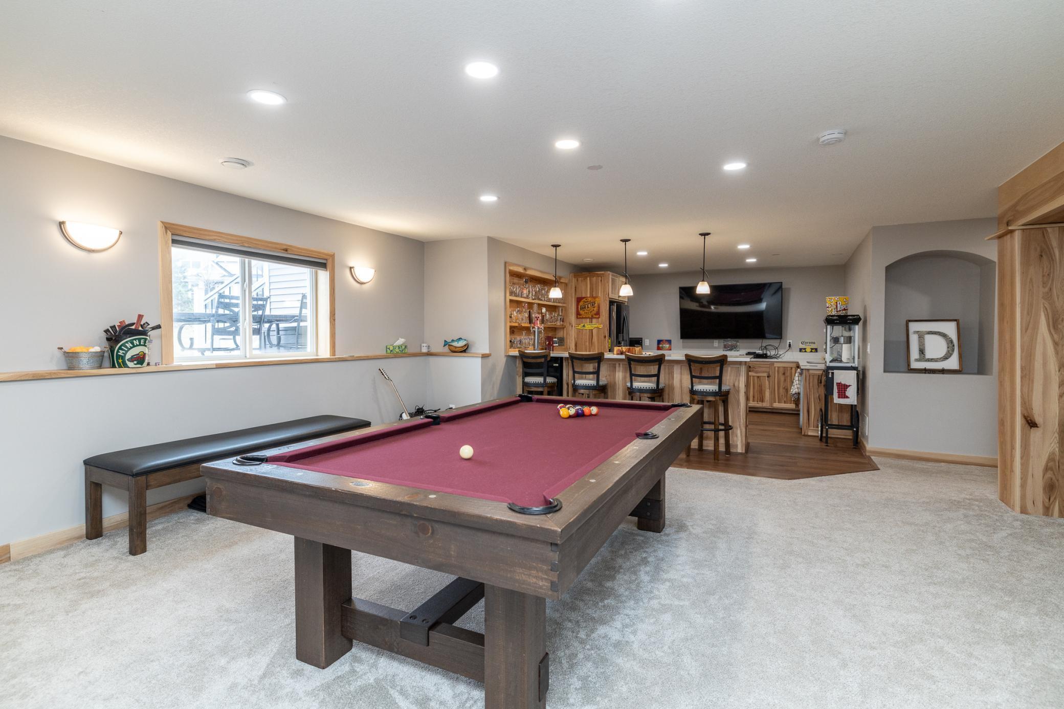 Lower-level recreation area with billiards space and open layout
