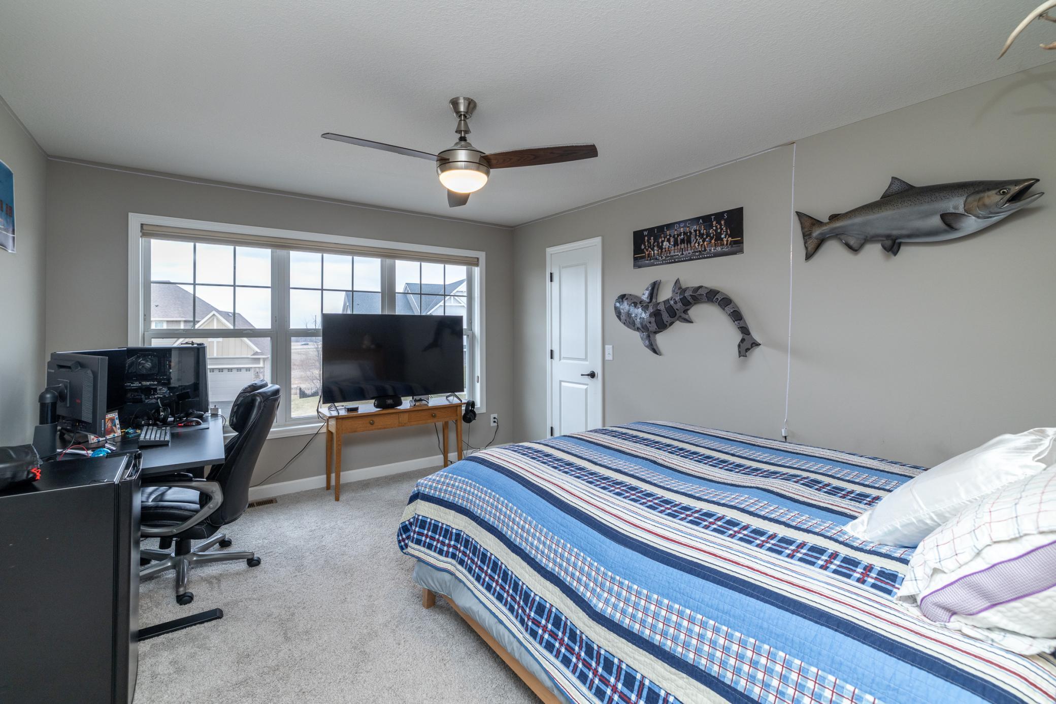 Large bedroom filled with natural light and generous space