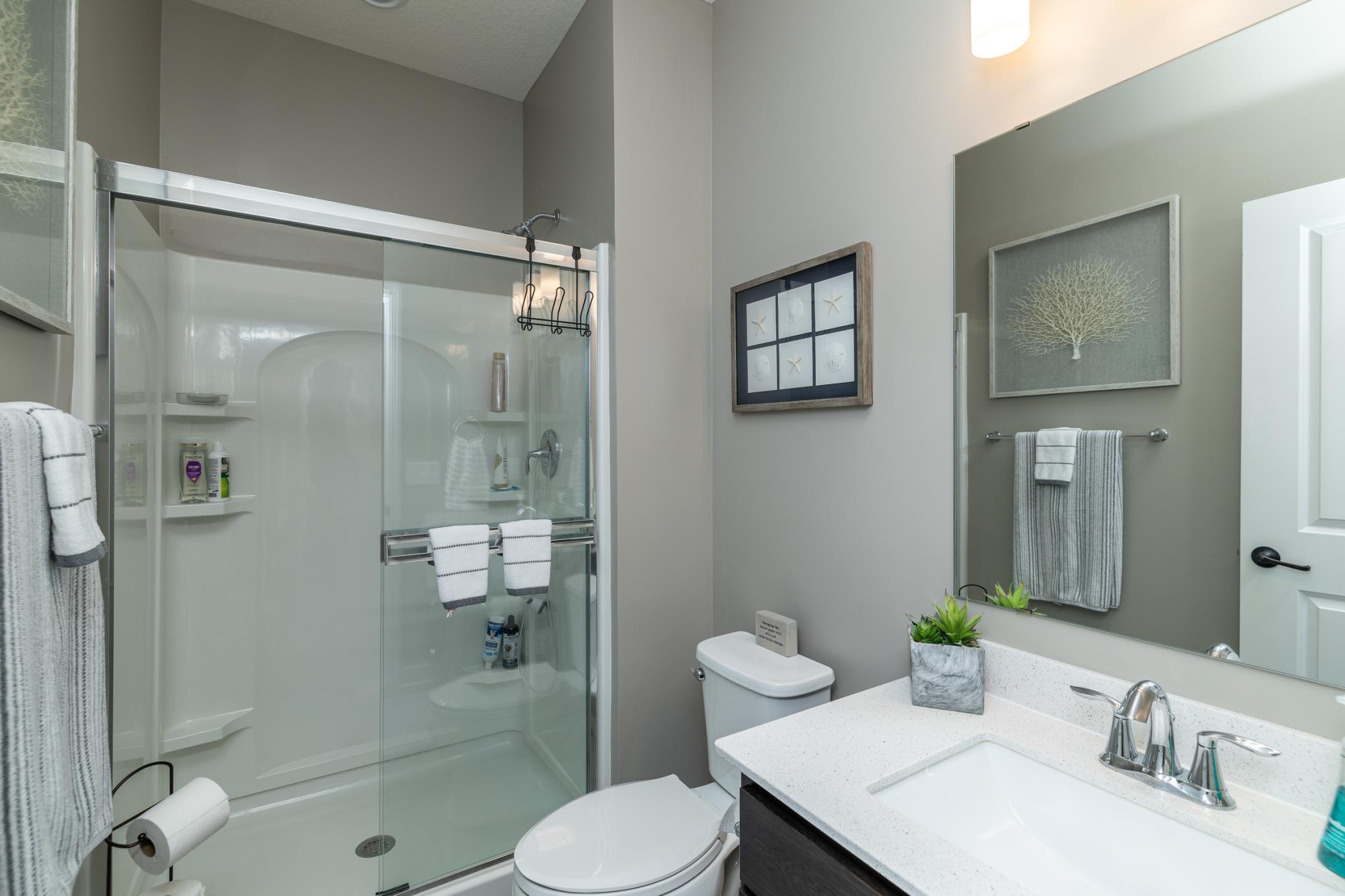 Main-level 3/4 bathroom with stylish finishes and convenient access