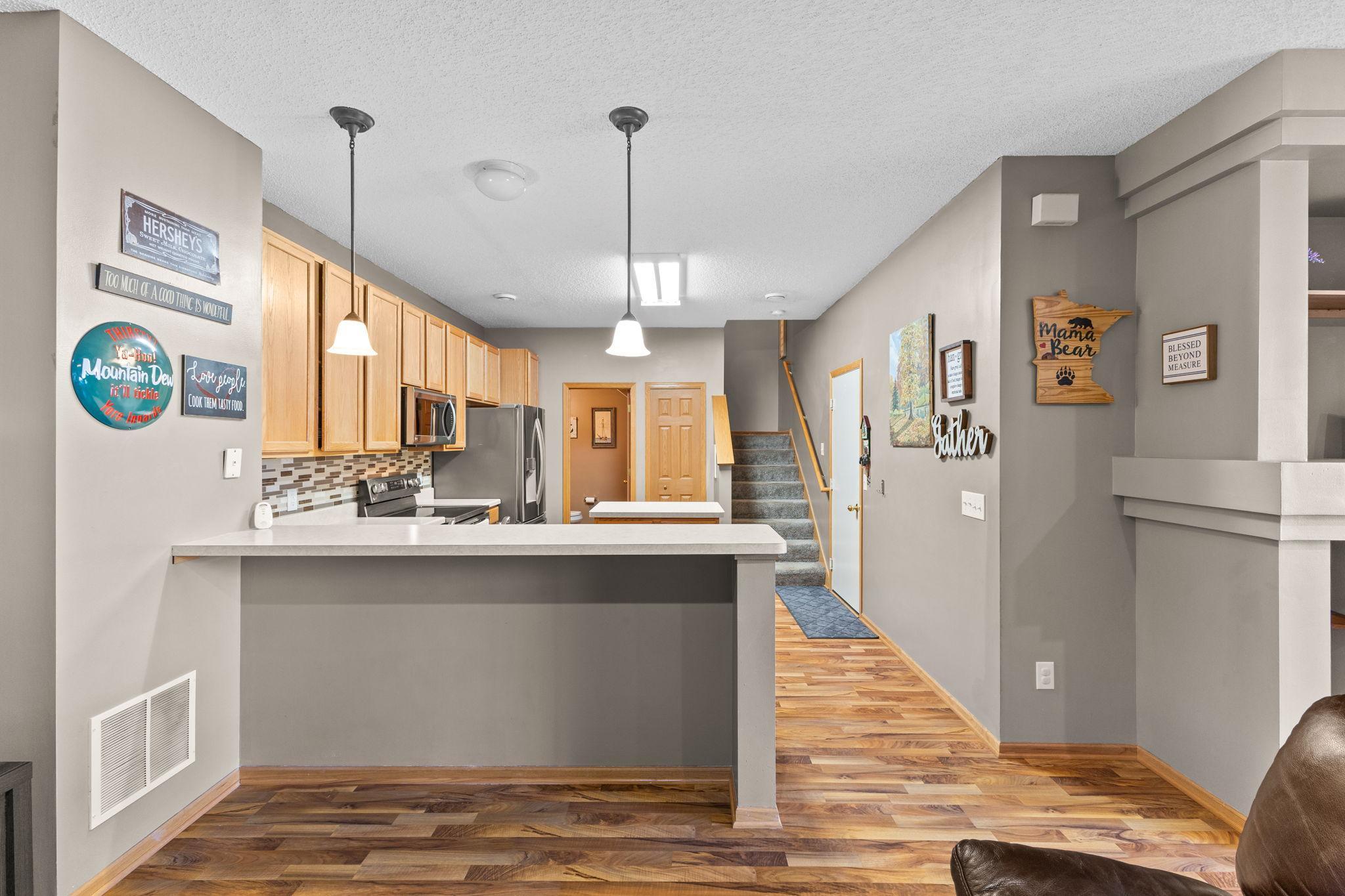 Open kitchen design with island and seamless connection to living and dining areas