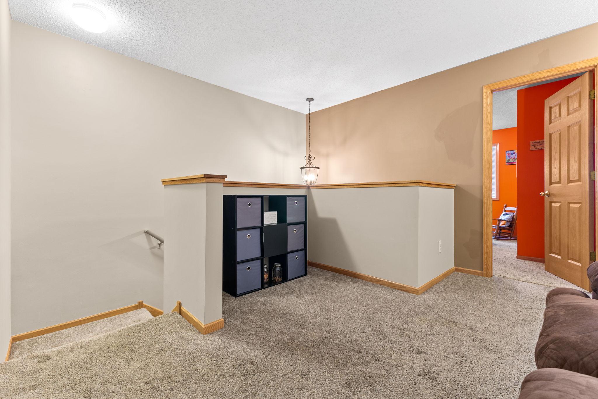 Versatile upper-level loft—perfect for a home office, reading nook, or play area