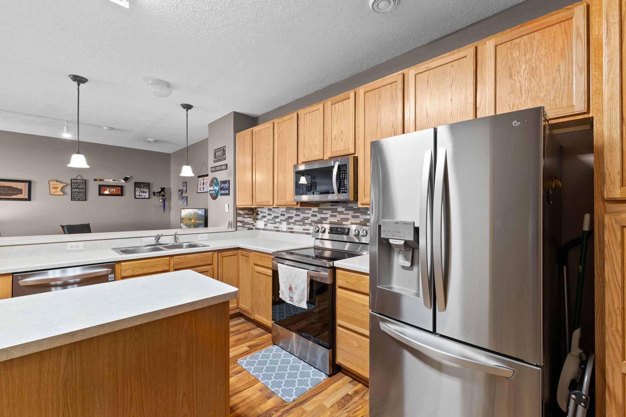 Stainless steel appliances and efficient layout make this kitchen easy to enjoy