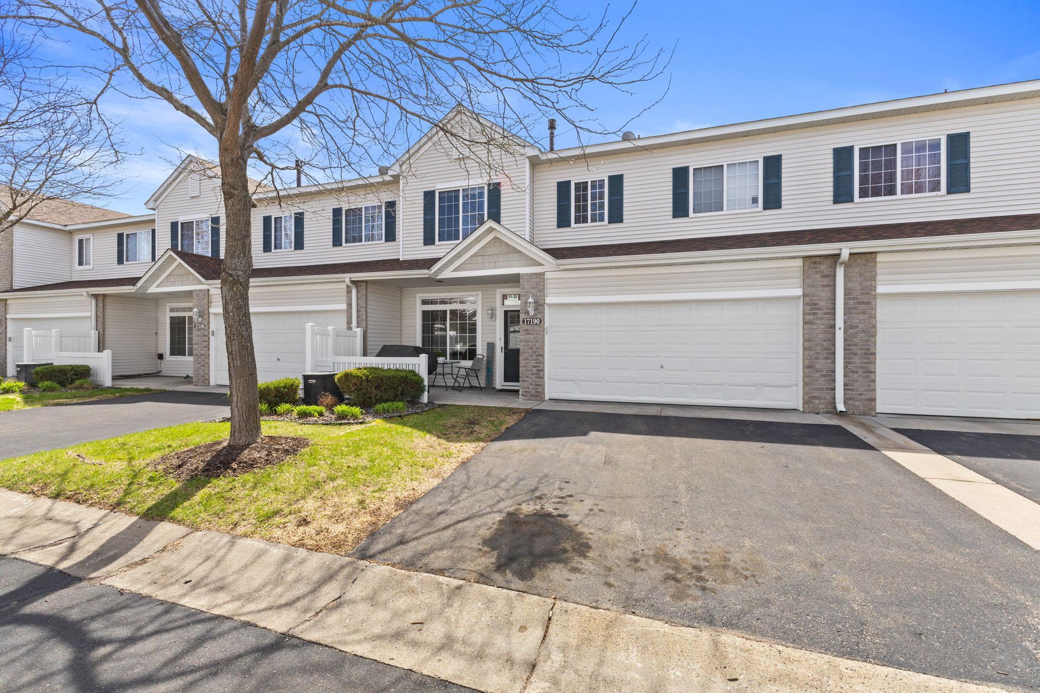 Well-maintained townhome with attached 2-car garage and welcoming curb appeal.