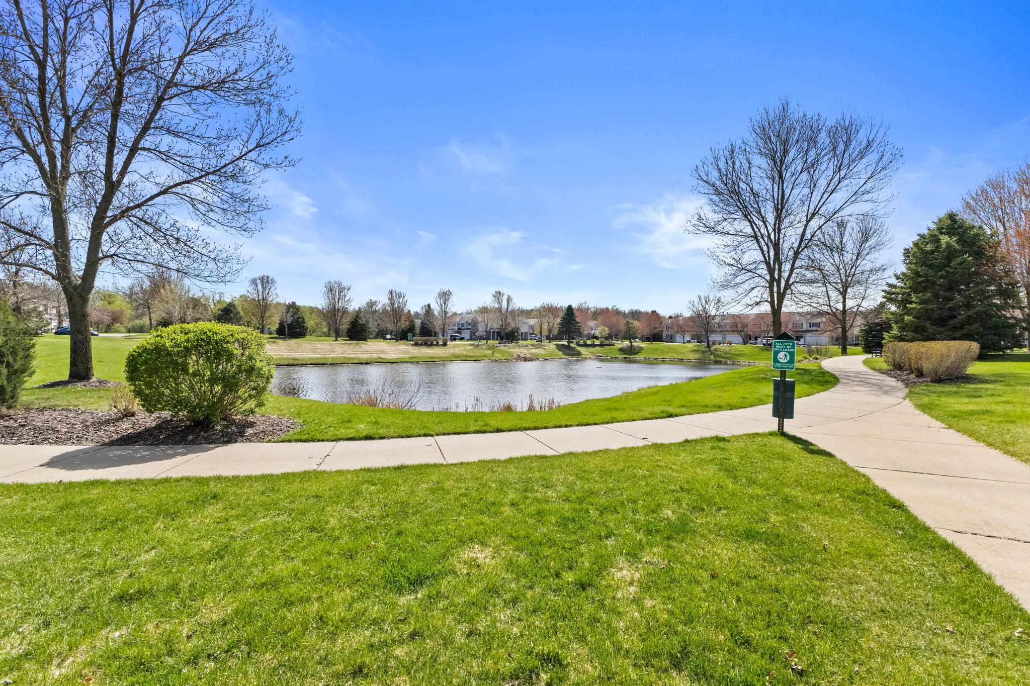 Peaceful neighborhood pond with scenic walking paths just steps from your door