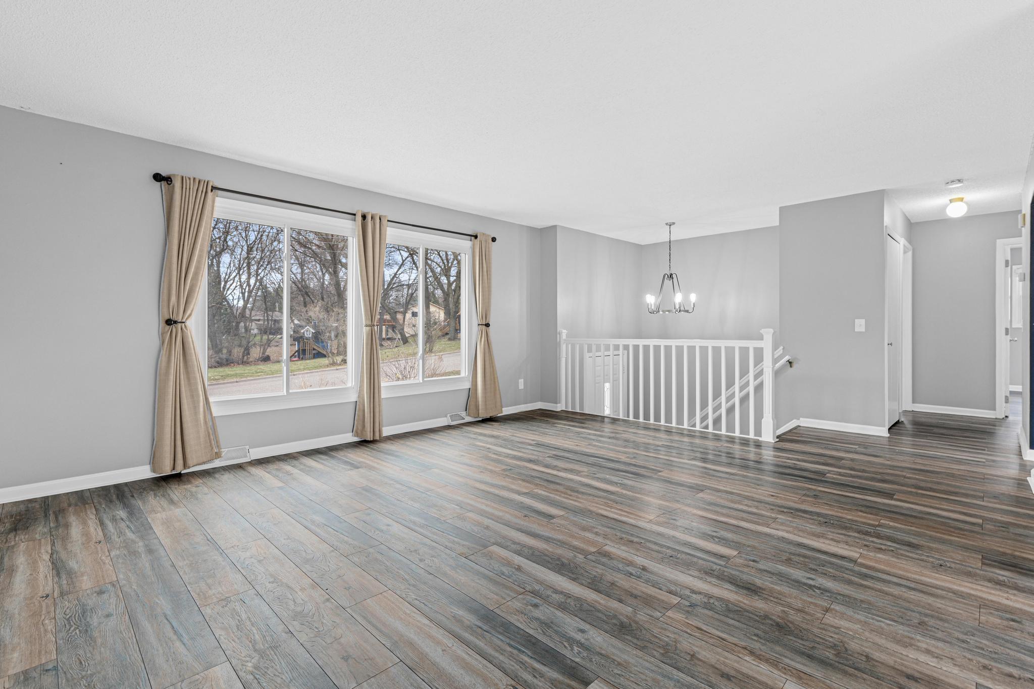 A view from the living room to the stairway/entry.