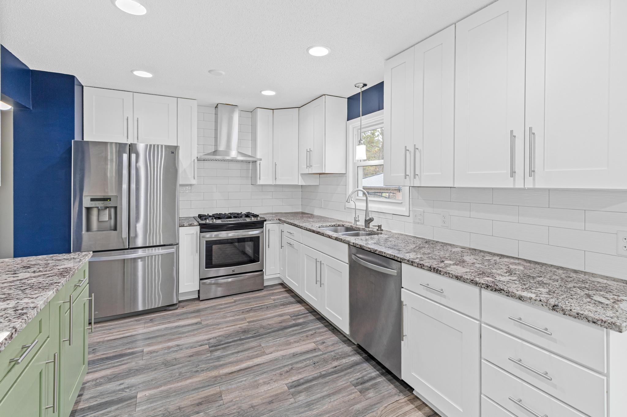 Stainless steel appliances & granite countertops.