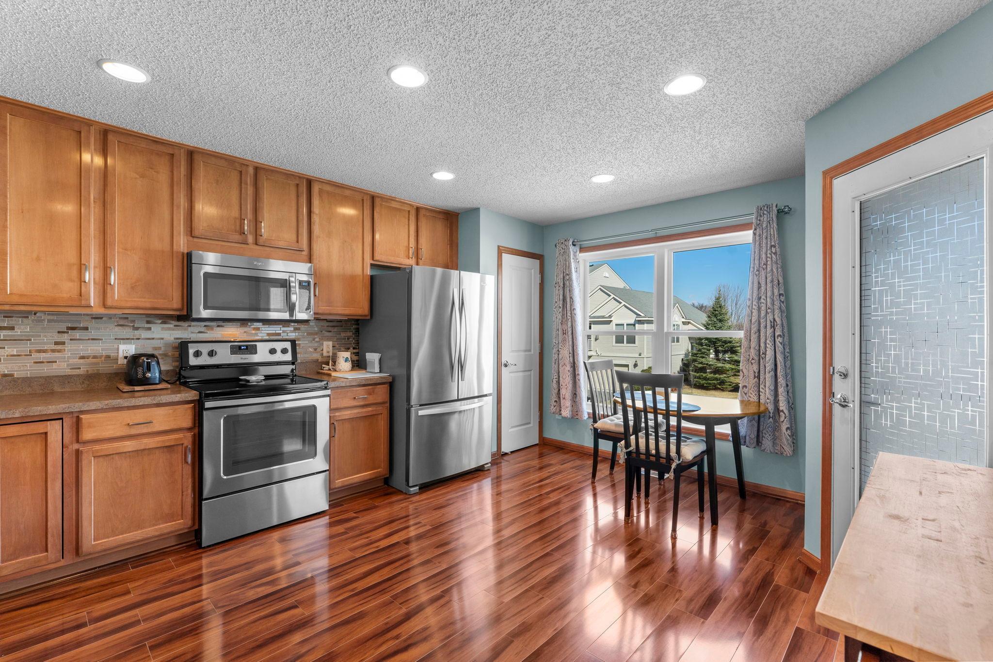 Full suite of stainless steel appliances and large windows for natural light