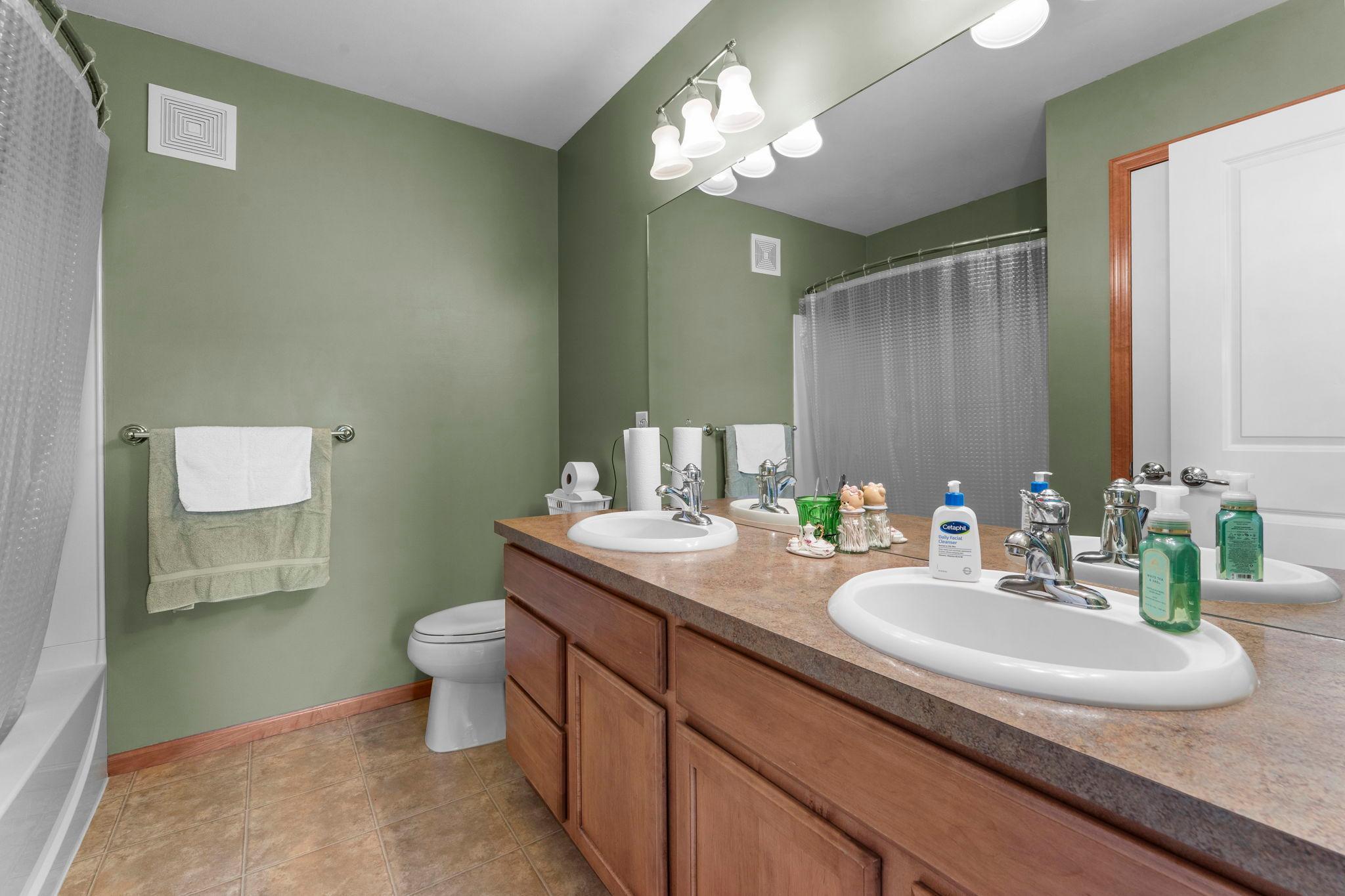 Primary full bathroom has double sinks