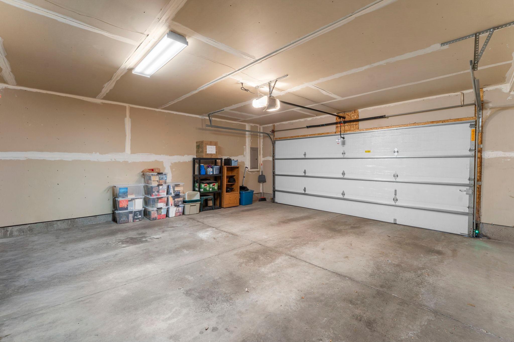 View of the garage from the door - a little additional storage area on the side and good lighting