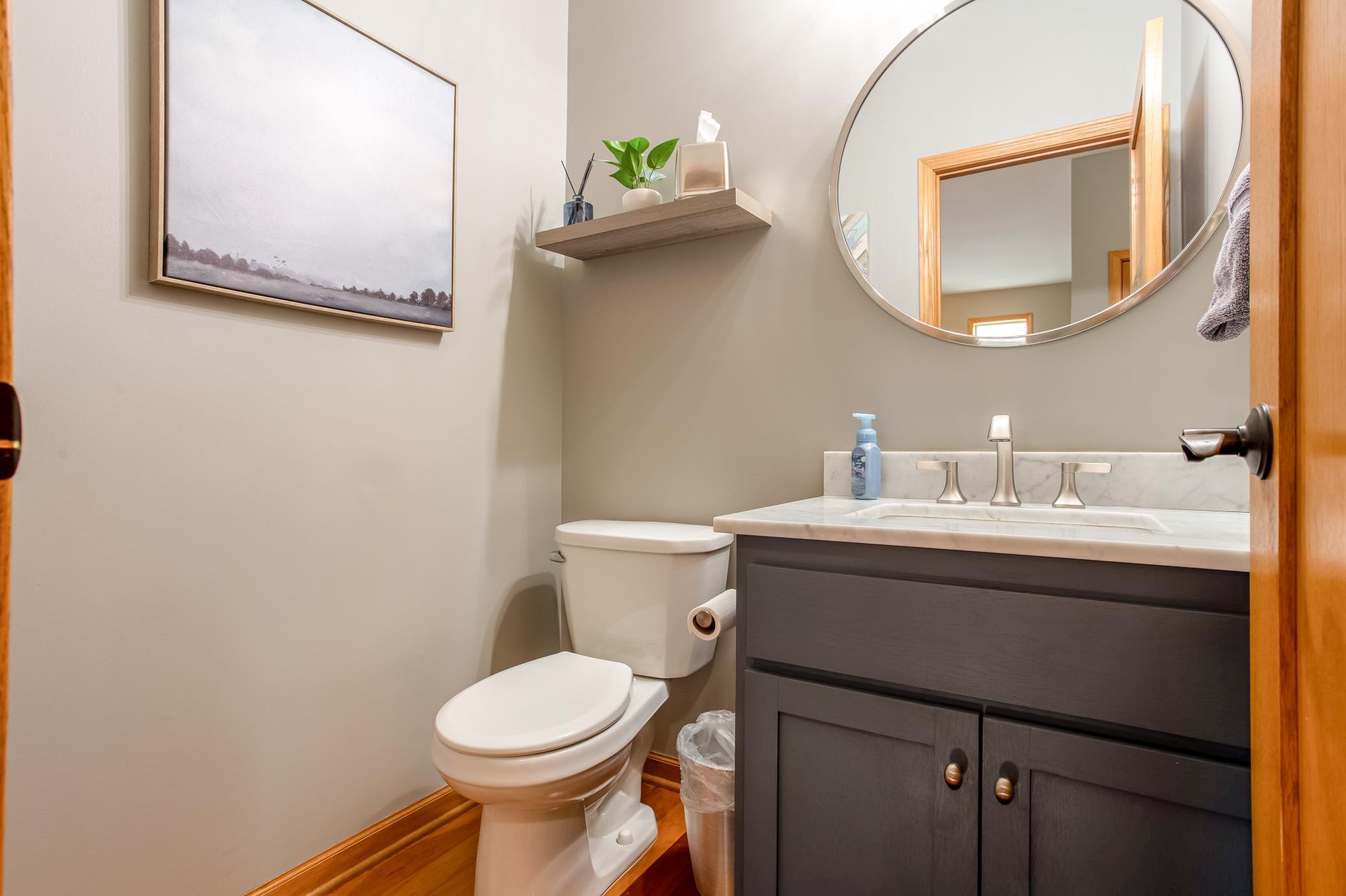 Updated powder room featuring stylish finishes, modern fixtures, and a clean contemporary design.