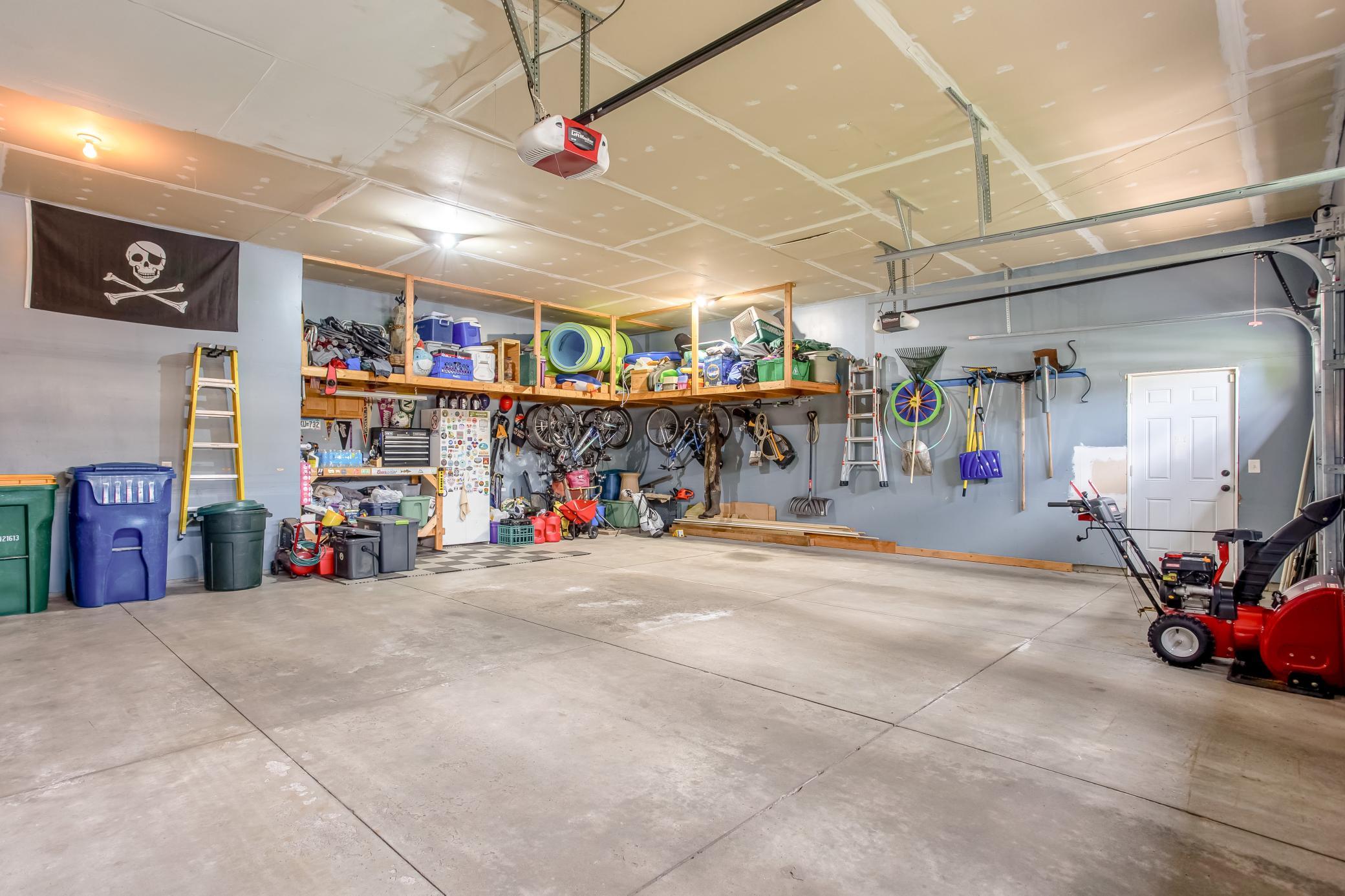 Extra-deep multi-car garage with built-in storage solutions and exceptional space for hobbies, organization, and everyday convenience.