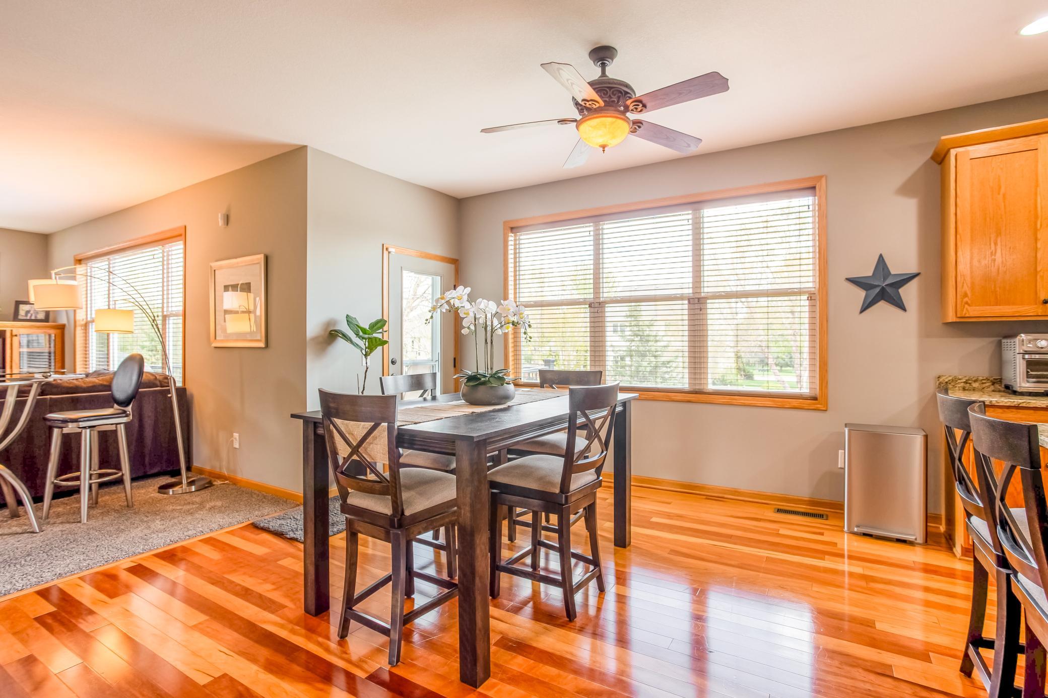 Sun-filled informal dining area with oversized windows and direct access to the nearby outdoor living spaces.