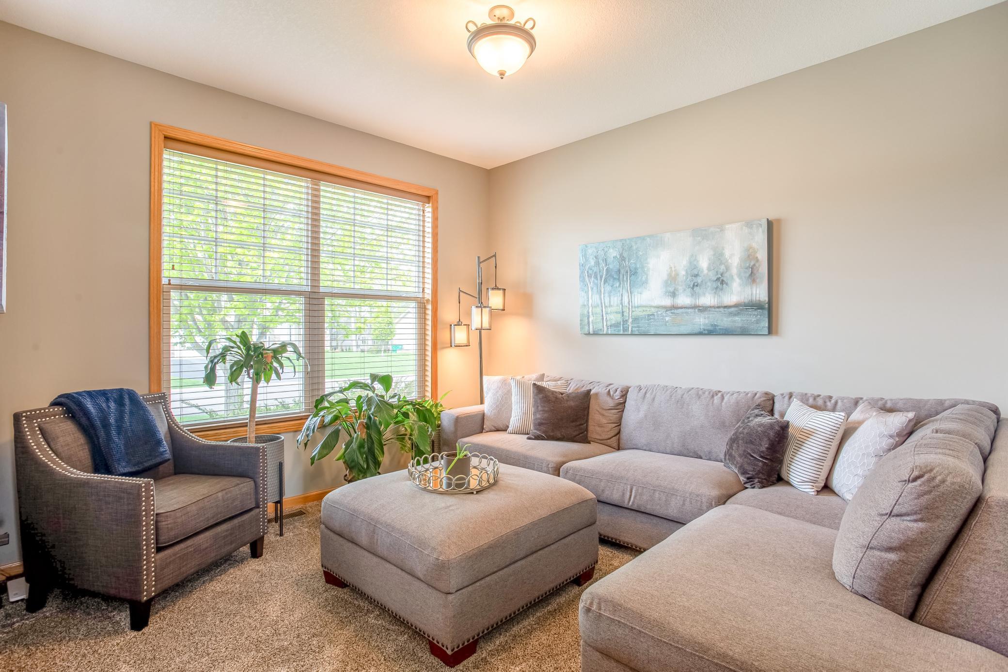 Bright and relaxing sitting room filled with natural light and the perfect space to unwind or entertain guests.