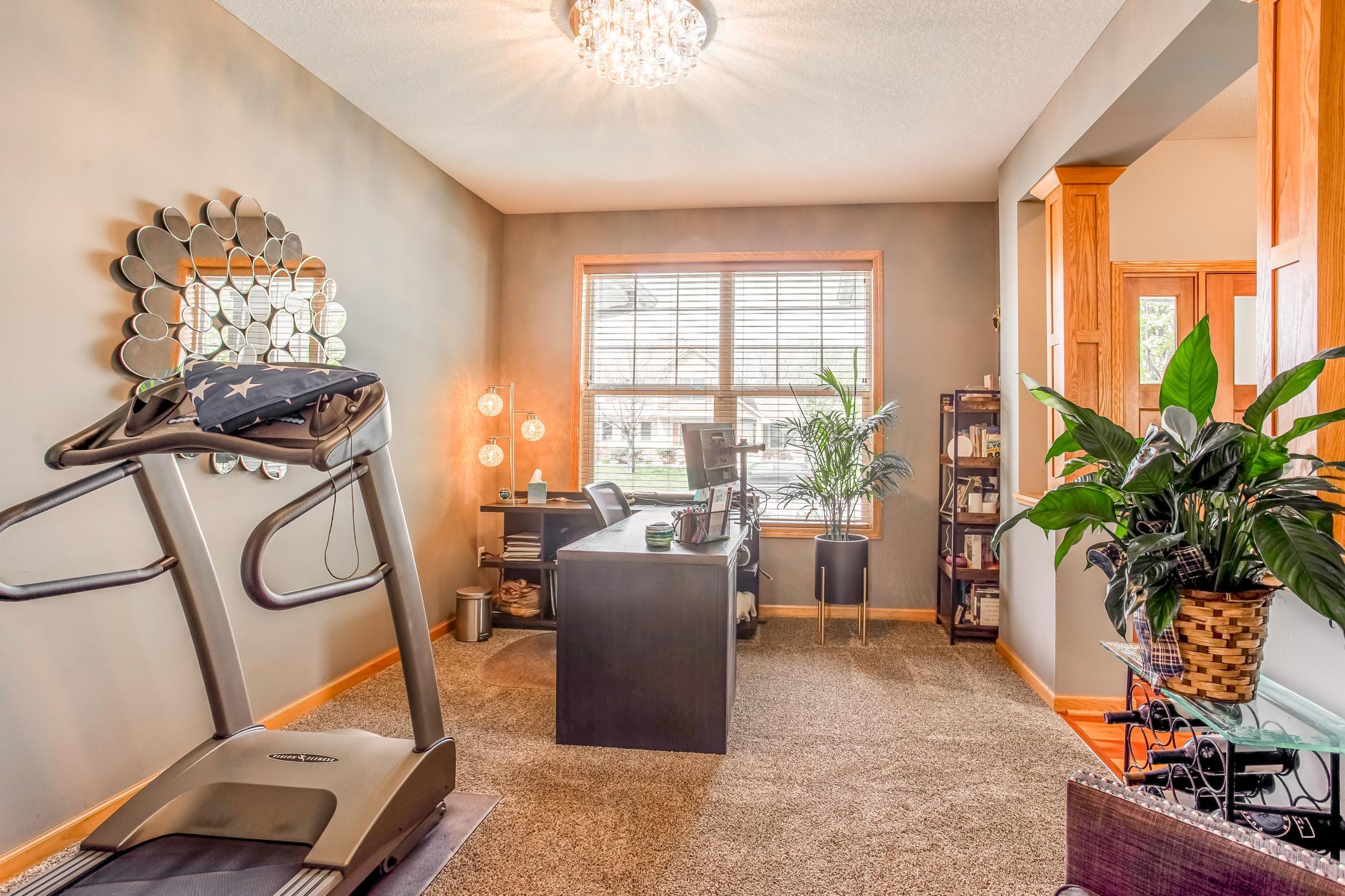 Versatile dining room ideal for a formal dining area, home office, or creative studio with abundant natural light.