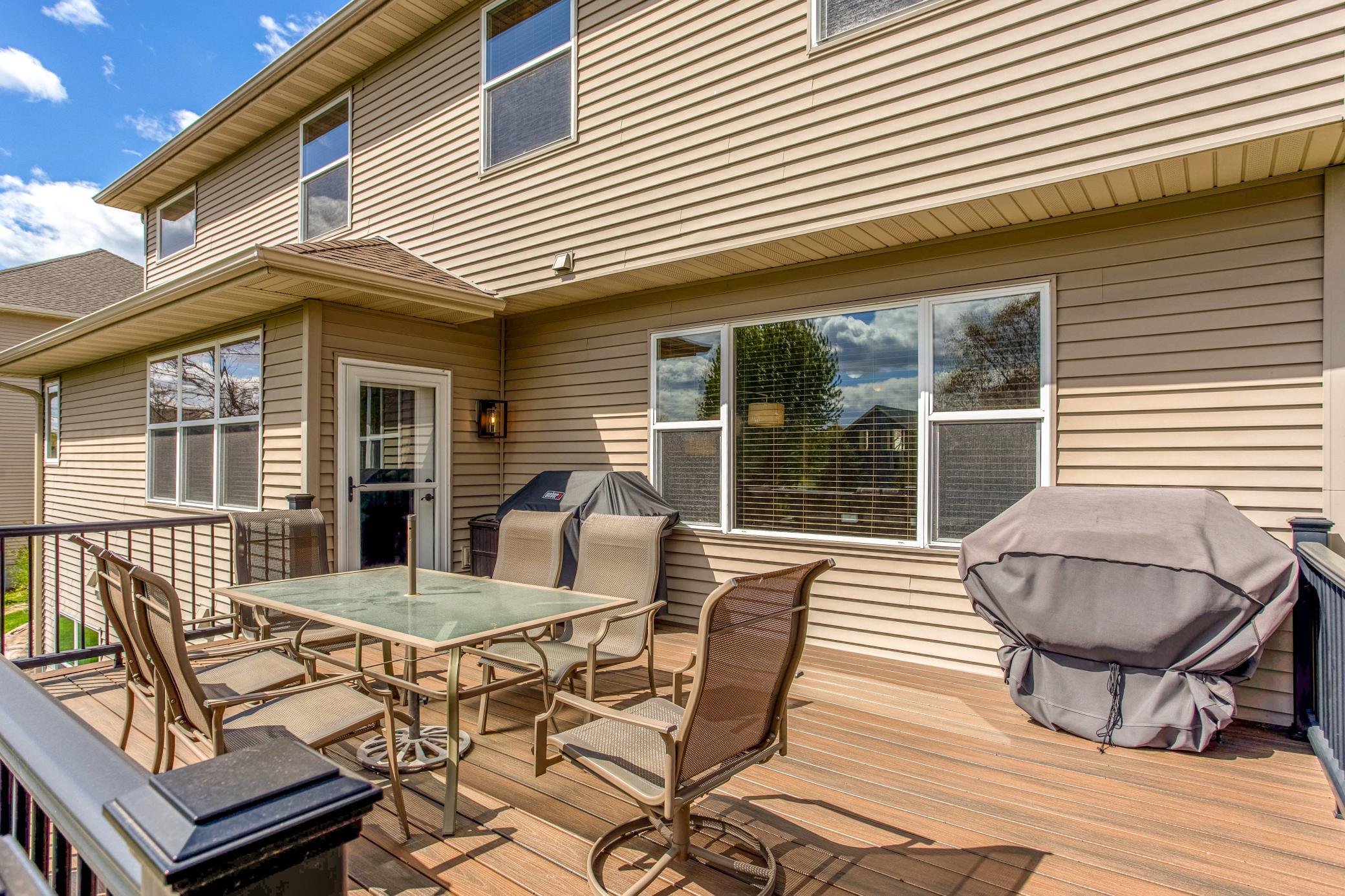 Generous deck space with grilling area and direct access to the home, creating the perfect setup for summer gatherings.