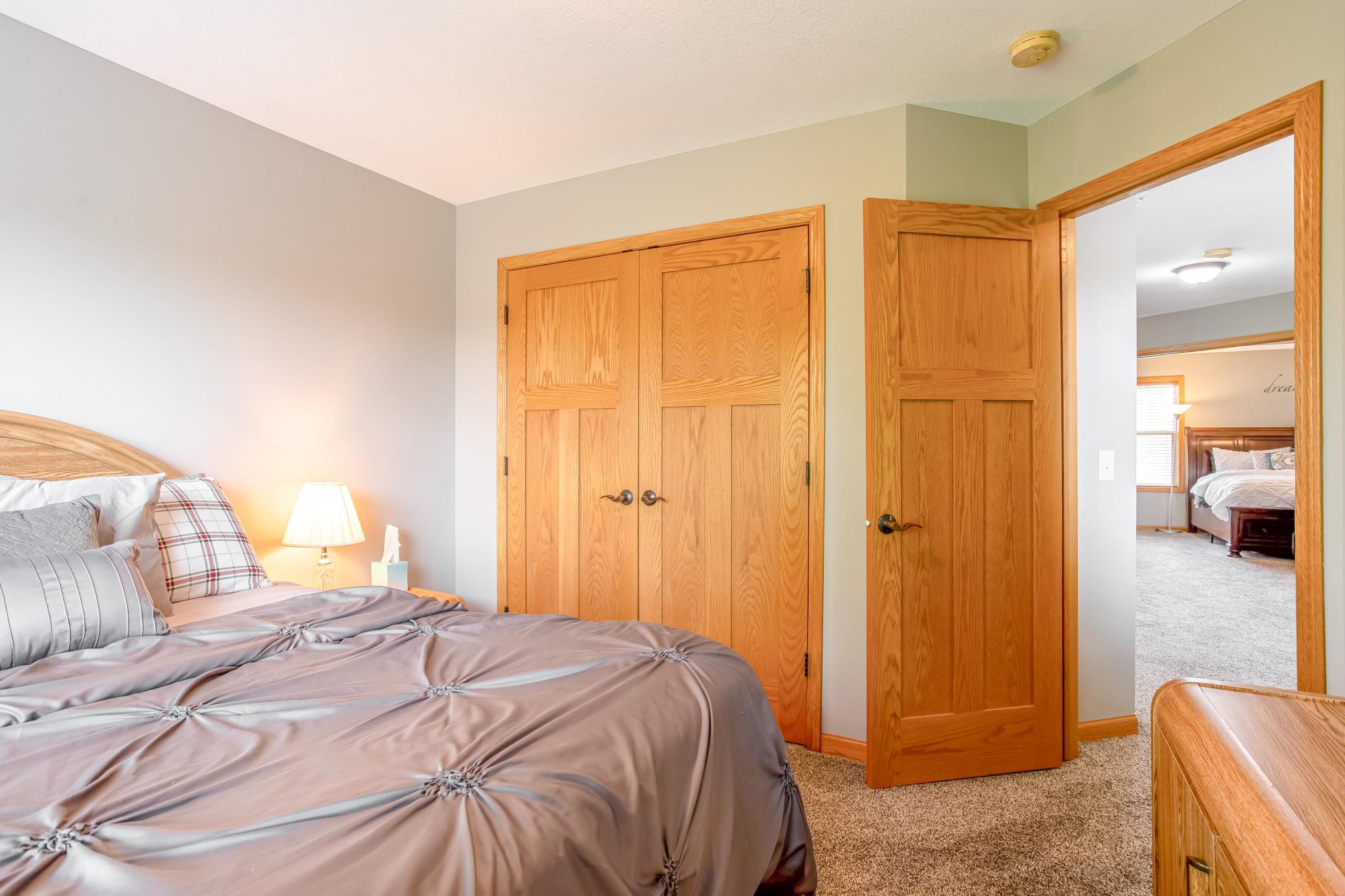 Well-appointed bedroom offering generous closet space and a functional layout ideal for guests or family.
