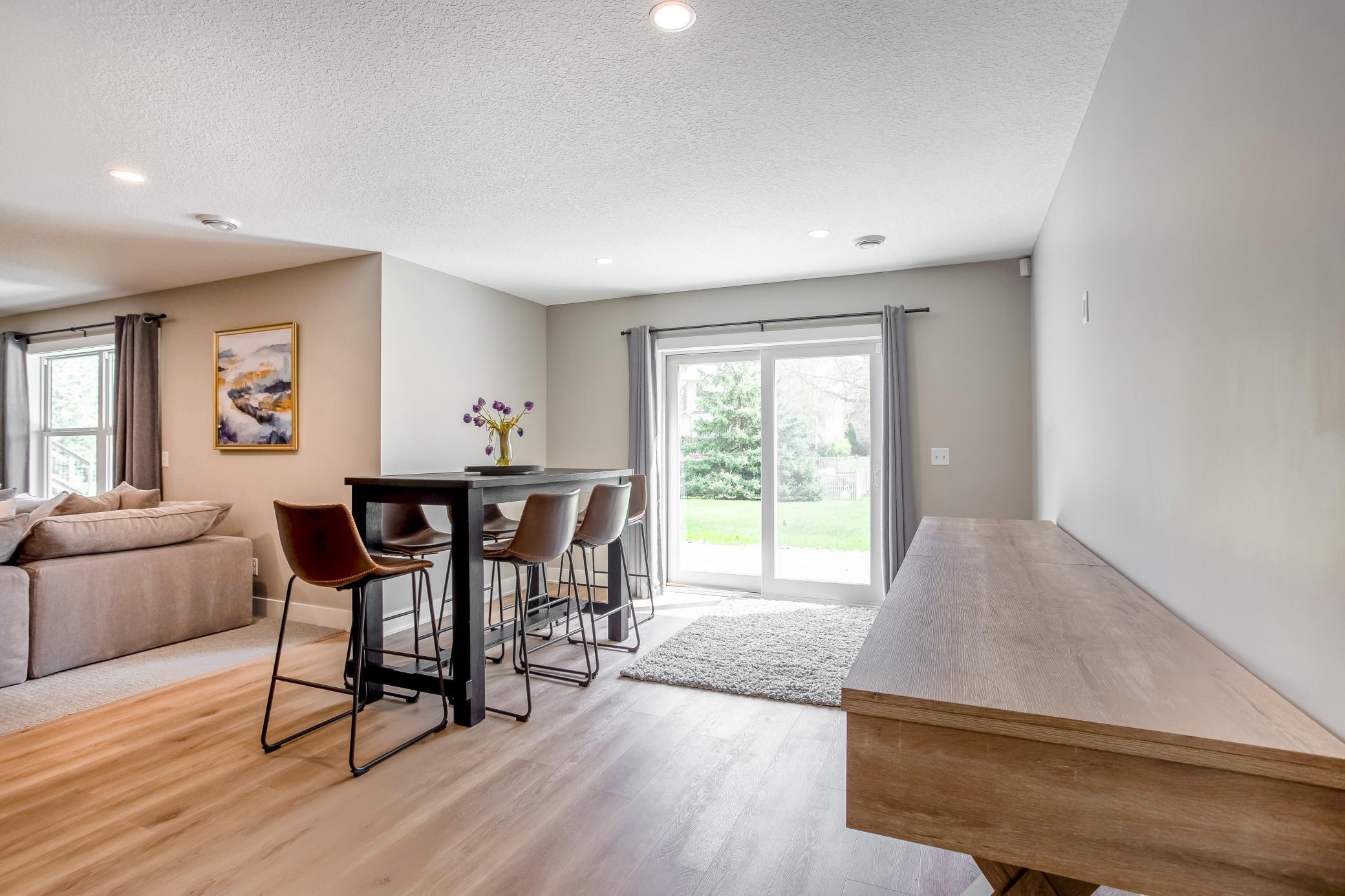 Bright recreation area with walkout access to the backyard and flexible space for everyday living or hosting.