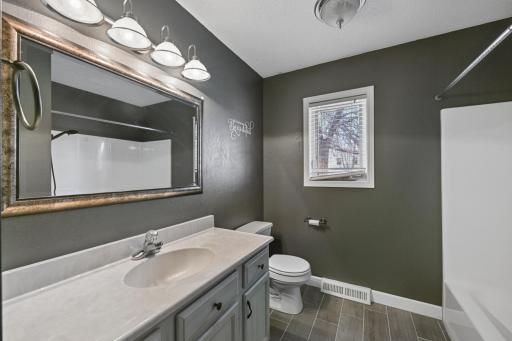 Main floor full bath with lots of storage space