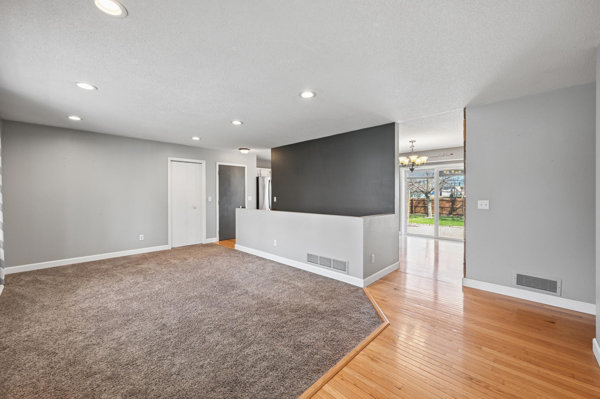 Living room opens up into dining and kitchen