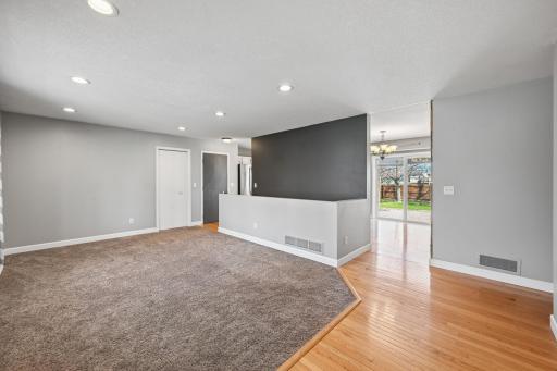 Living room opens up into dining and kitchen