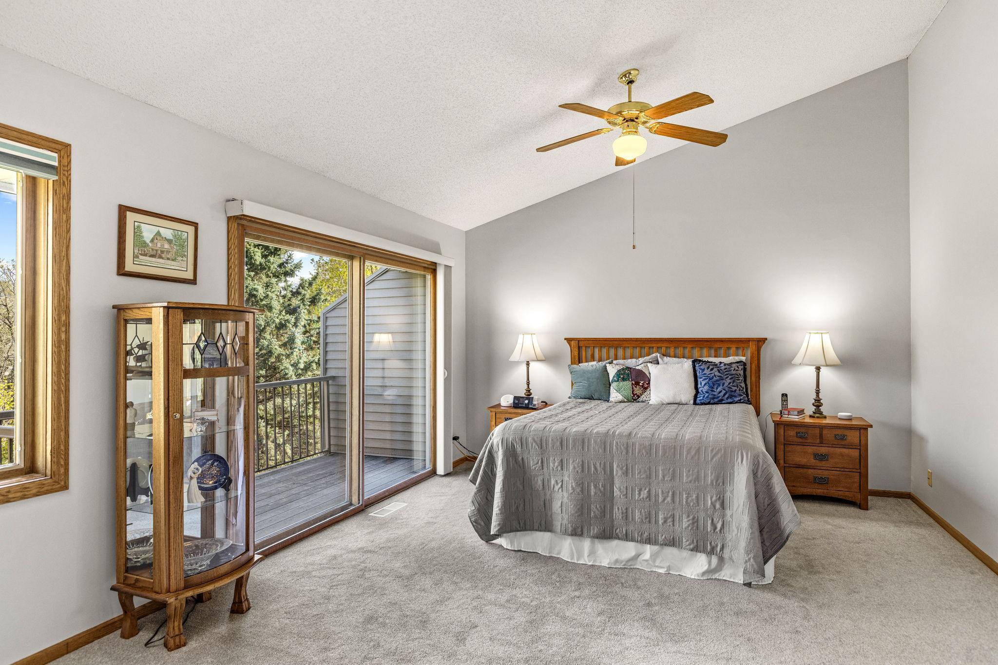 Upper level primary suite with vaulted ceilings and a private deck!