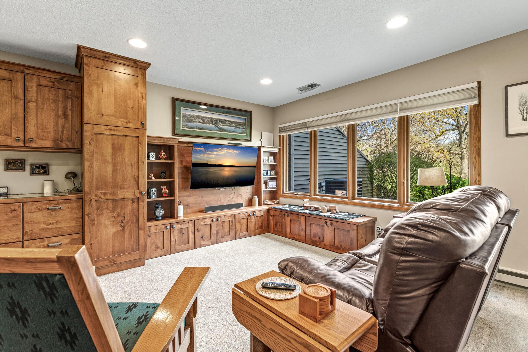 Lower level family room walkout includes a wet bar, extra space for games or entertaining. Not to mention the beautiful high quality built in cabinetry!