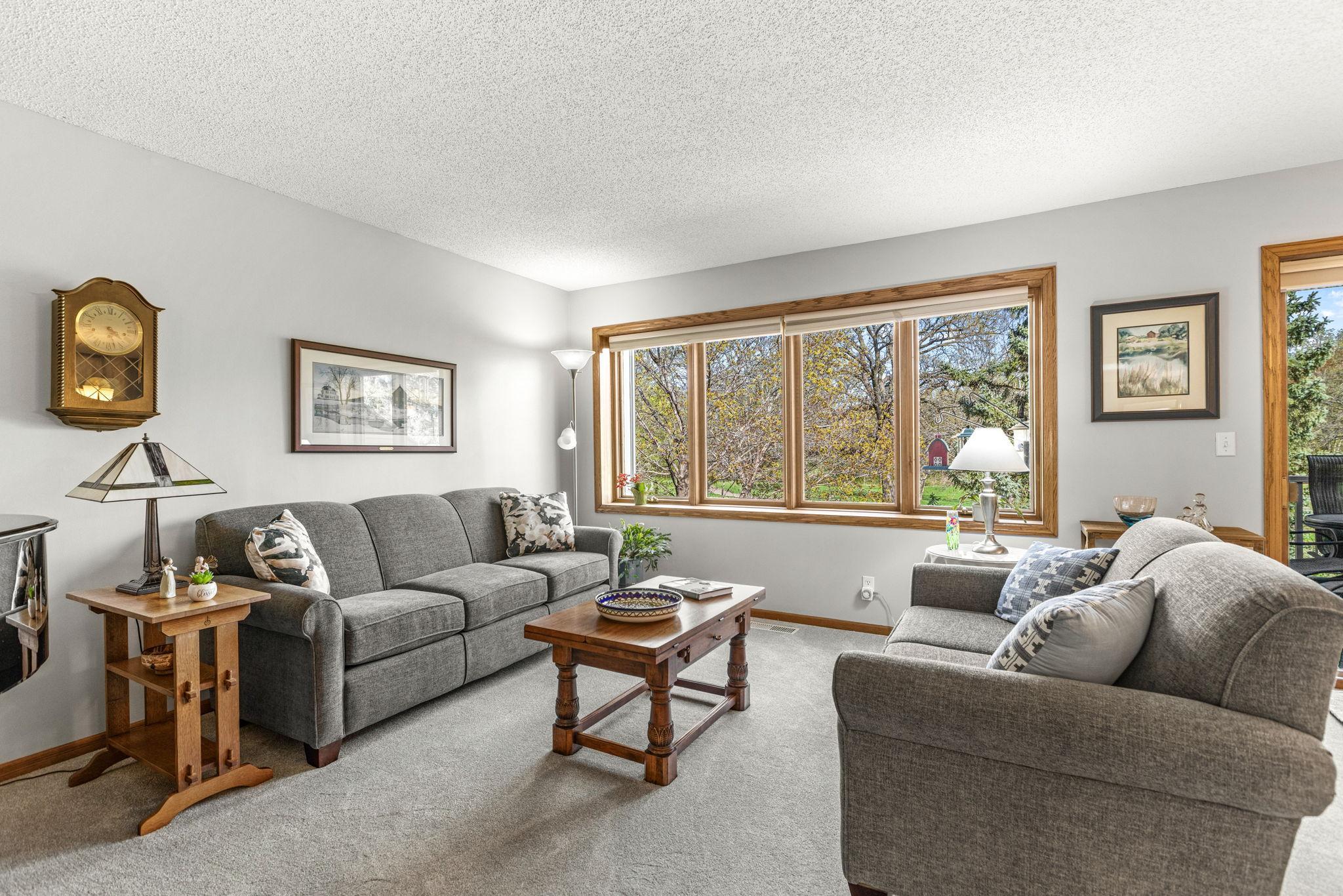 Spacious living room with new carpet (2025) and freshly painted too!
